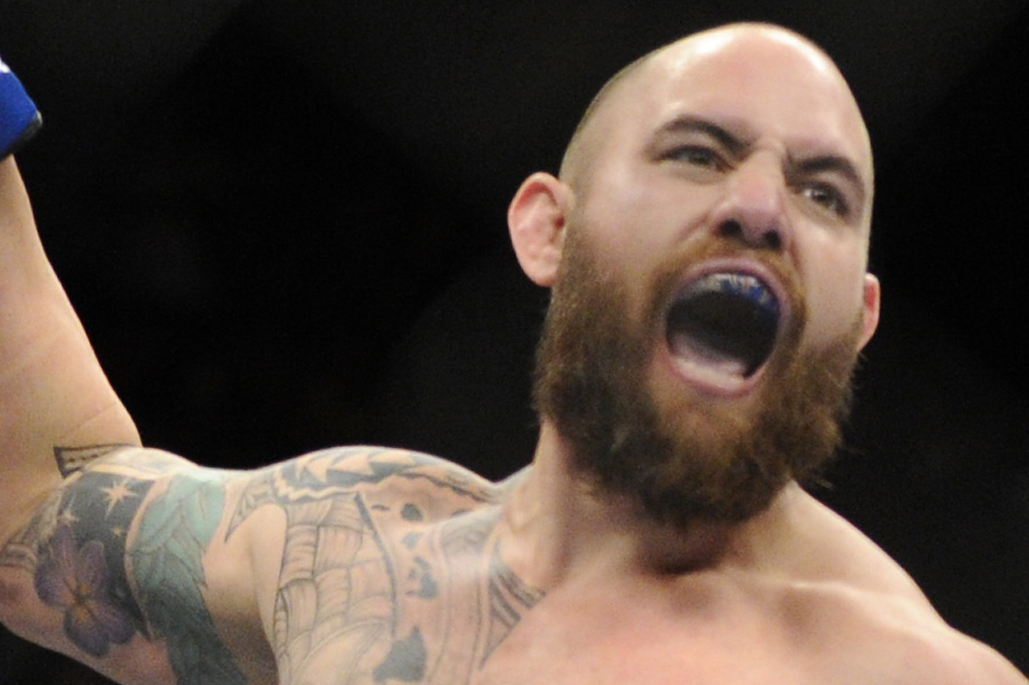 Travis Browne, of Albuquerque, N.M., reacts after defeating Josh Barnett, of Fullerton, Calif. ,during a UFC 168 mixed martial arts heavyweight bout on  Saturday, Dec. 28, 2013, in Las Vegas. Browne won by a knockout in the first round. (AP Photo/David Becker)