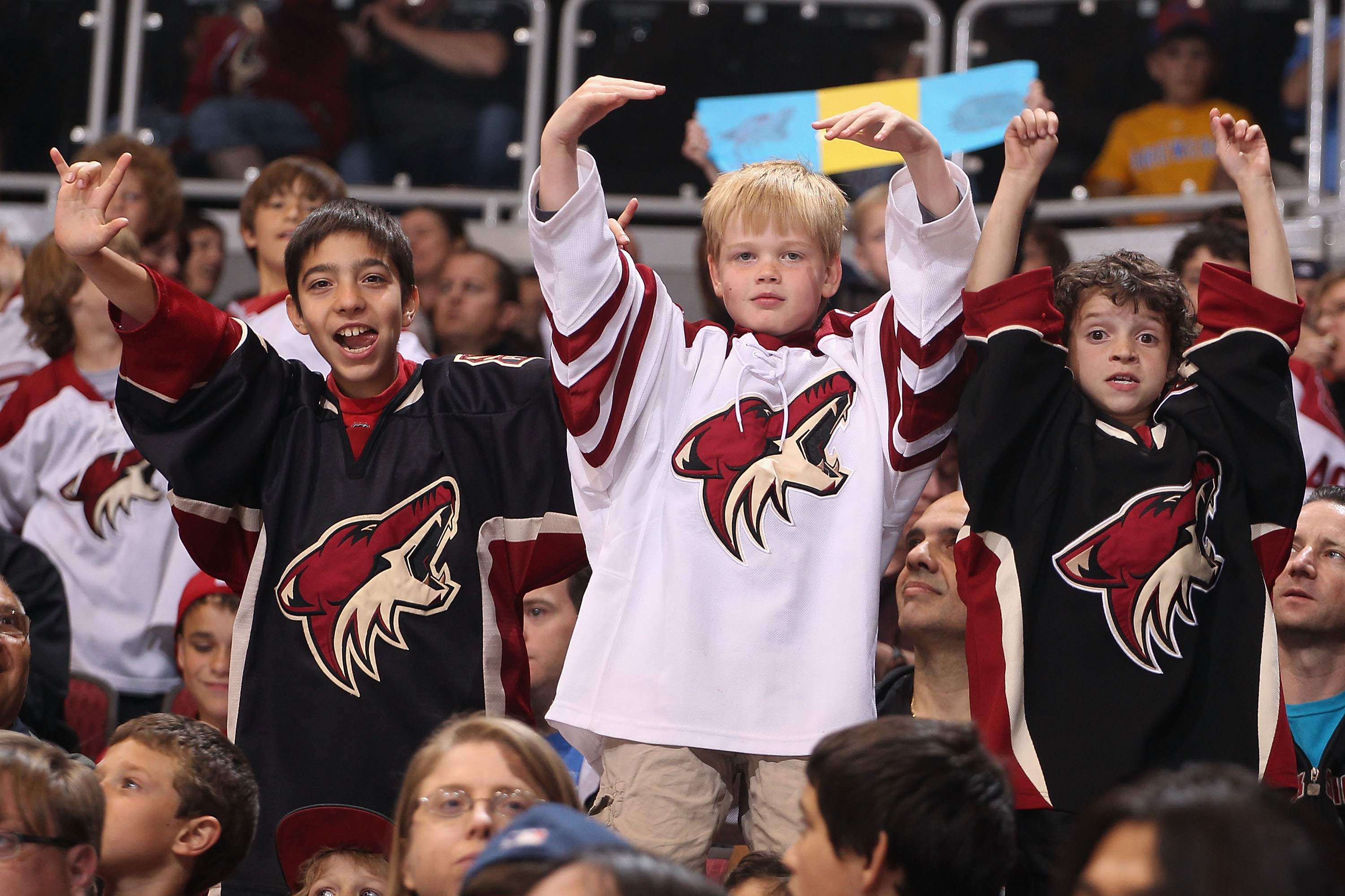 GLENDALE, AZ - MARCH 31:  A young fans of the Phoenix Coyotes cheer during the NHL game against the Anaheim Ducks at Jobing.com Arena on March 31, 2012 in Glendale, Arizona.  The Coyotes defeated the Ducks 4-0.  (Photo by Christian Petersen/Getty Images)
