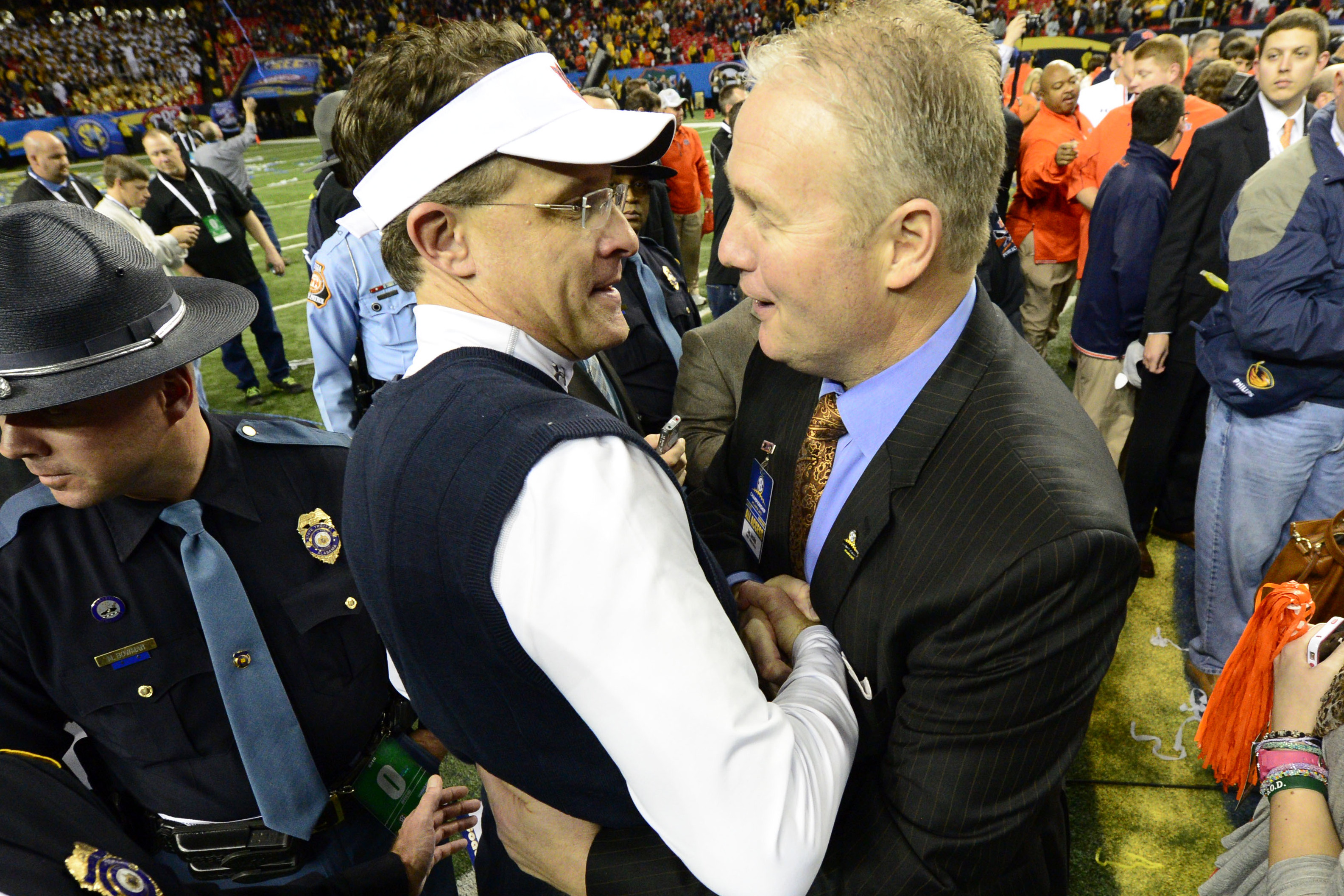 Dec 7, 2013; Atlanta, GA, USA; Auburn Tigers head coach Gus Malzahn celebrates with athletic director Jay Jacobs after the 2013 SEC Championship game against the Missouri Tigers at Georgia Dome. Auburn won 59-42. Mandatory Credit: John David Mercer-USA TODAY Sports