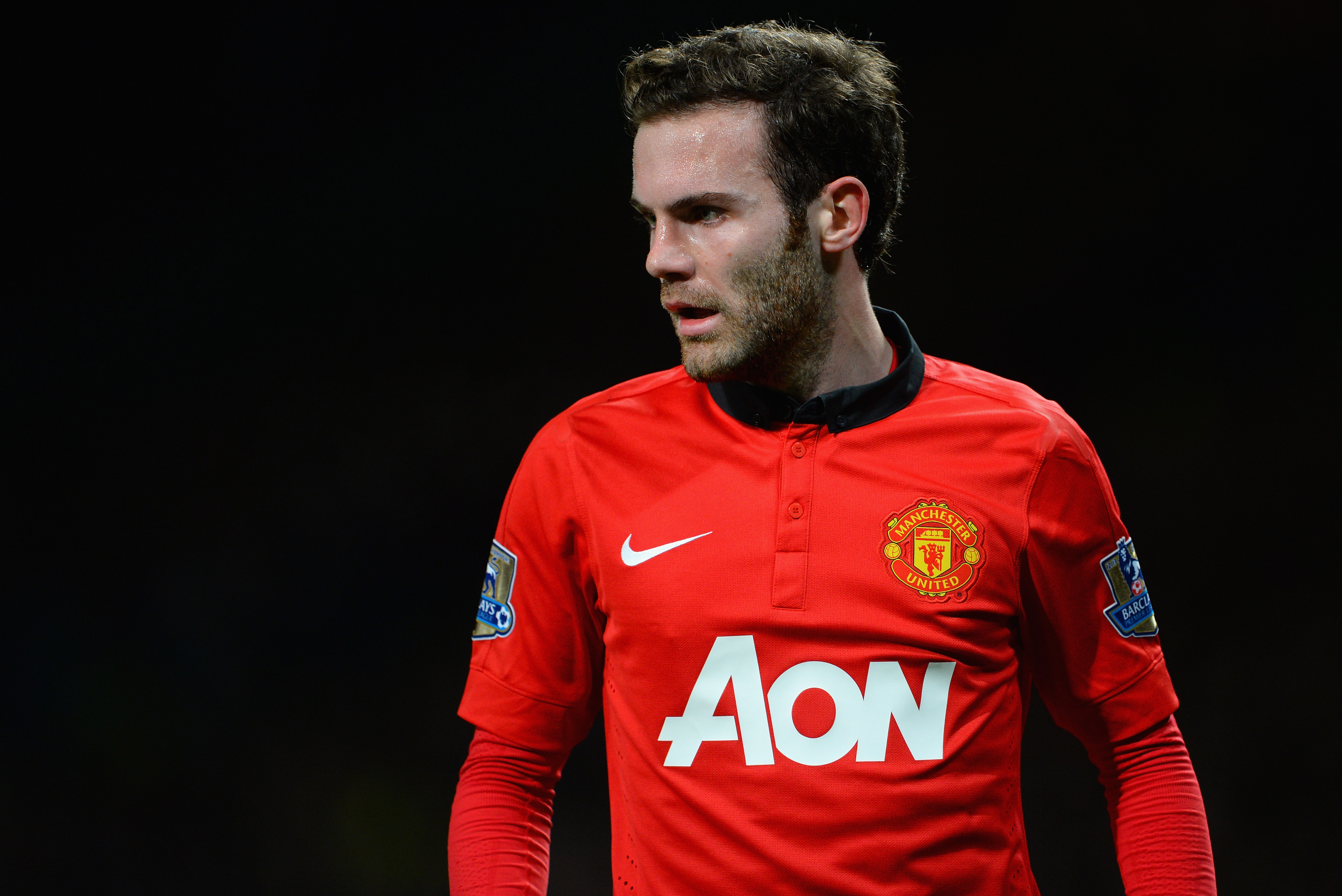 MANCHESTER, ENGLAND - JANUARY 28:  New signing Juan Mata of Manchester United looks on during the Barclays Premier League match between Manchester United and Cardiff City at Old Trafford on January 28, 2014 in Manchester, England.  (Photo by Michael Regan/Getty Images)