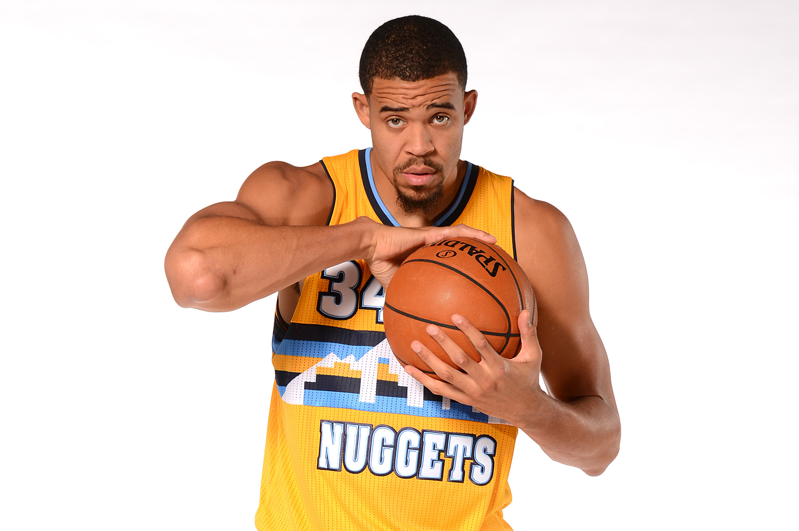 DENVER, CO - SEPTEMBER 30: JaVale McGee #34 of the Denver Nuggets poses for a photo on Media Day on September 30, 2013 at the Pepsi Center in Denver, Colorado. NOTE TO USER: User expressly acknowledges and agrees that, by downloading and/or using this Photograph, user is consenting to the terms and conditions of the Getty Images License Agreement. Mandatory Copyright Notice: Copyright 2013 NBAE (Photo by Garrett W. Ellwood/NBAE via Getty Images)