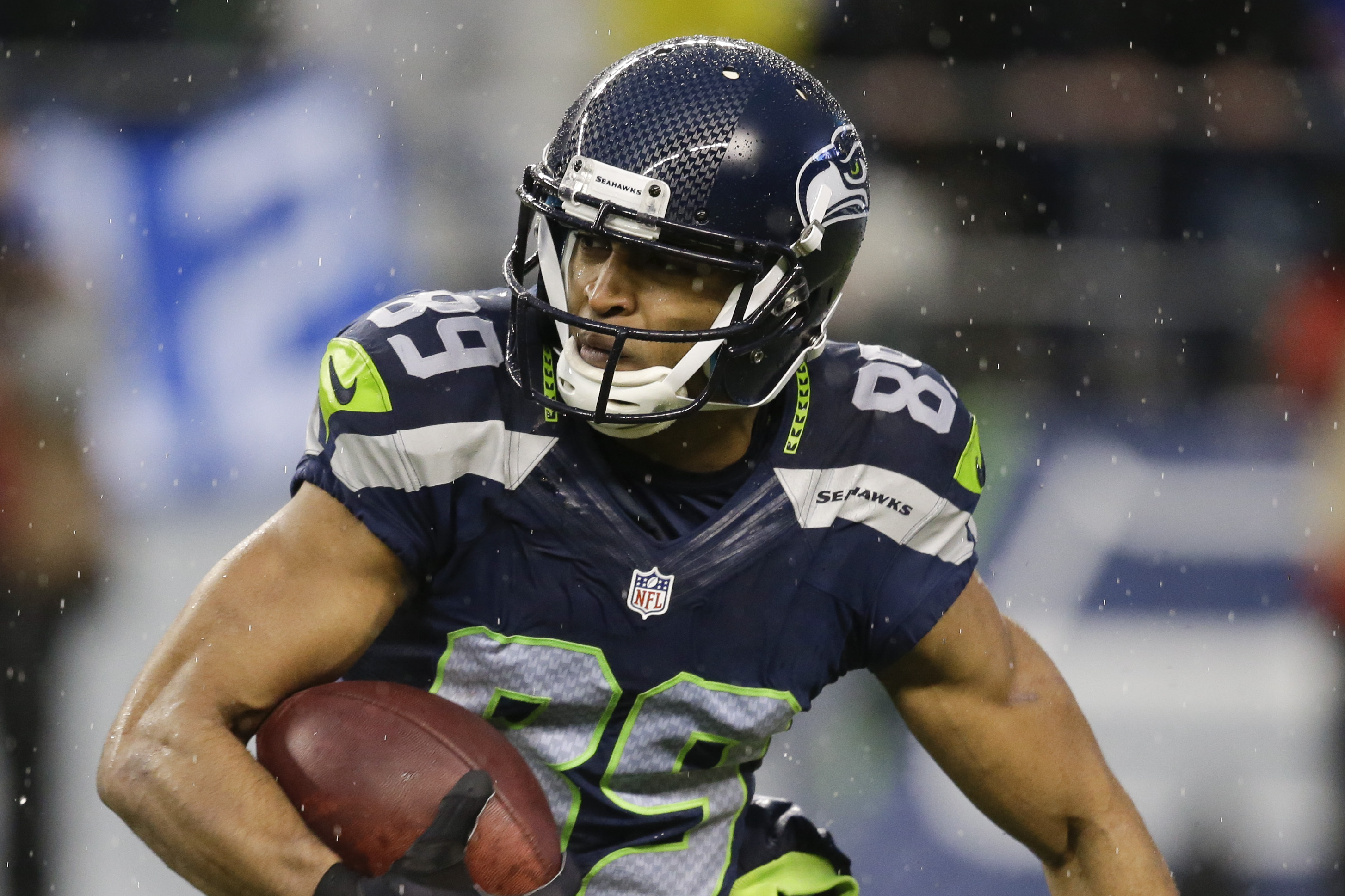 Seattle Seahawks wide receiver Doug Baldwin (89) runs against the New Orleans Saints during the second half of an NFC divisional playoff NFL football game in Seattle, Saturday, Jan. 11, 2014. (AP Photo/Elaine Thompson)