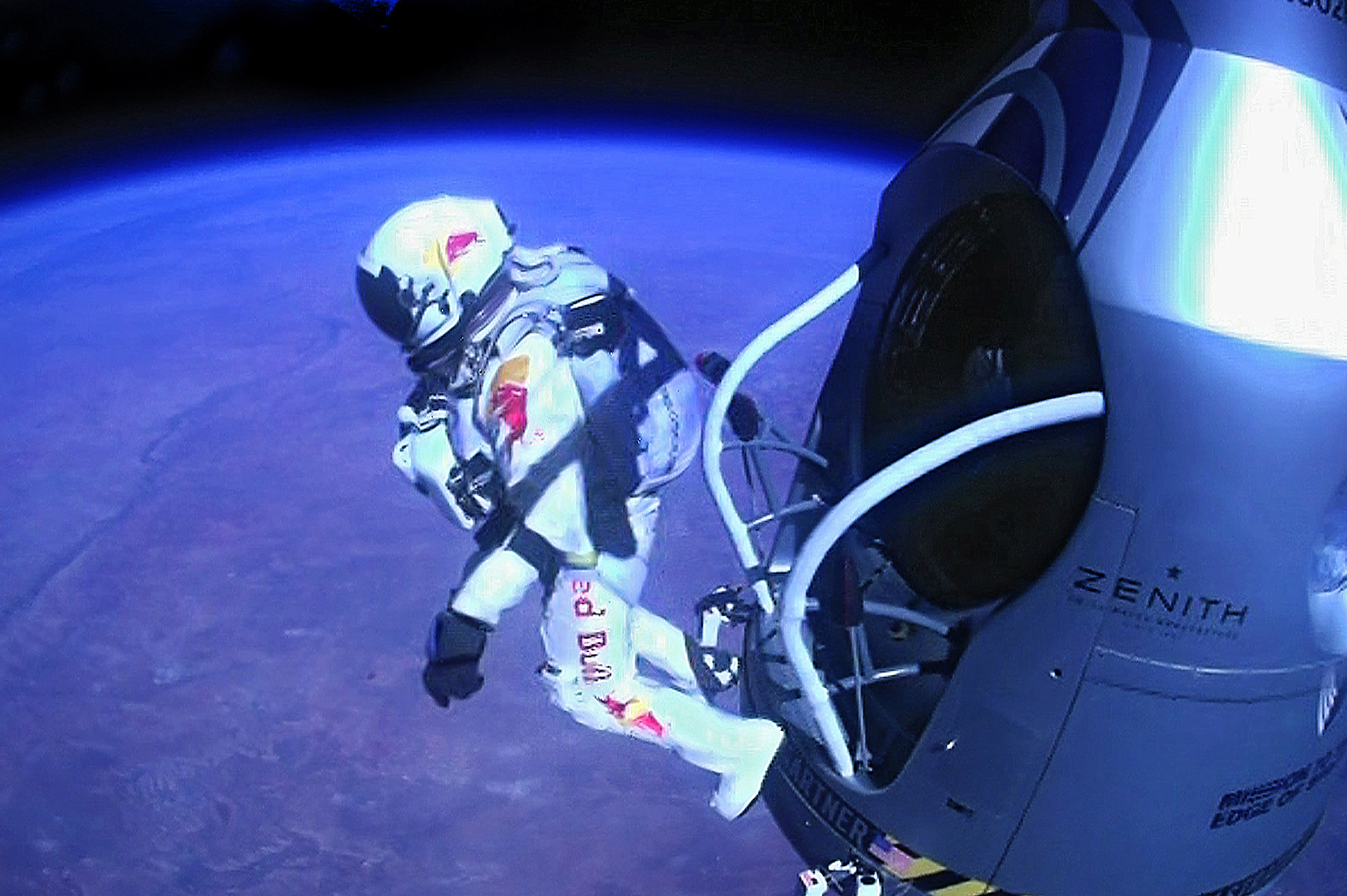 FOR USE AS DESIRED, YEAR END PHOTOS - FILE - In this Oct. 14, 2012 file photo provided by Red Bull Stratos, pilot Felix Baumgartner of Austria jumps out of the capsule during the final manned flight for Red Bull Stratos. In a giant leap from more than 24 miles up, Baumgartner shattered the sound barrier while making the highest jump ever with a tumbling, death-defying plunge from a balloon to a safe landing in the New Mexico desert. (AP Photo/Red Bull Stratos, File)