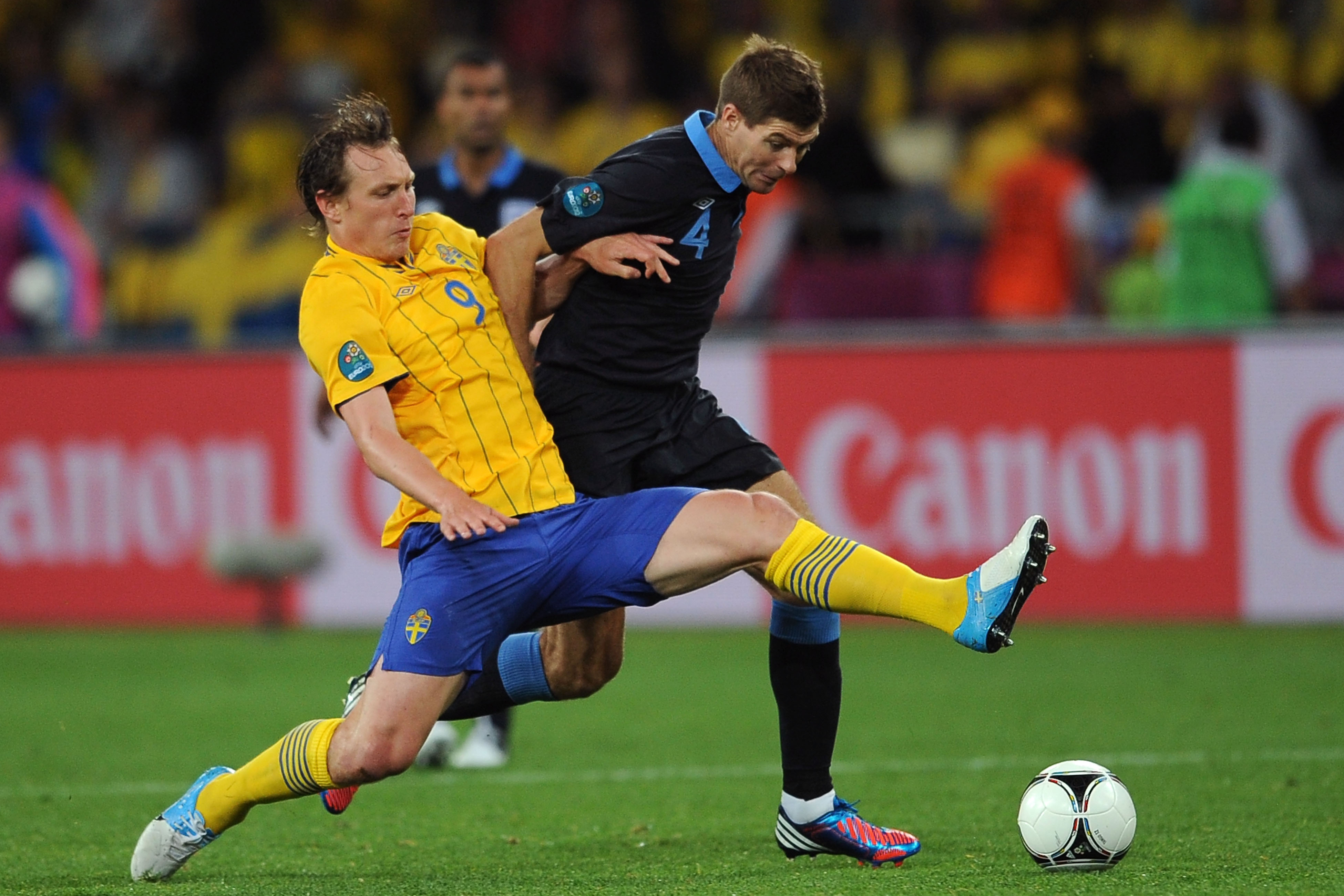 KIEV, UKRAINE - JUNE 15:  Kim Kallstrom of Sweden and Steven Gerrard of England battle for the ball during the UEFA EURO 2012 group D match between Sweden and England at The Olympic Stadium on June 15, 2012 in Kiev, Ukraine.  (Photo by Christopher Lee/Getty Images)