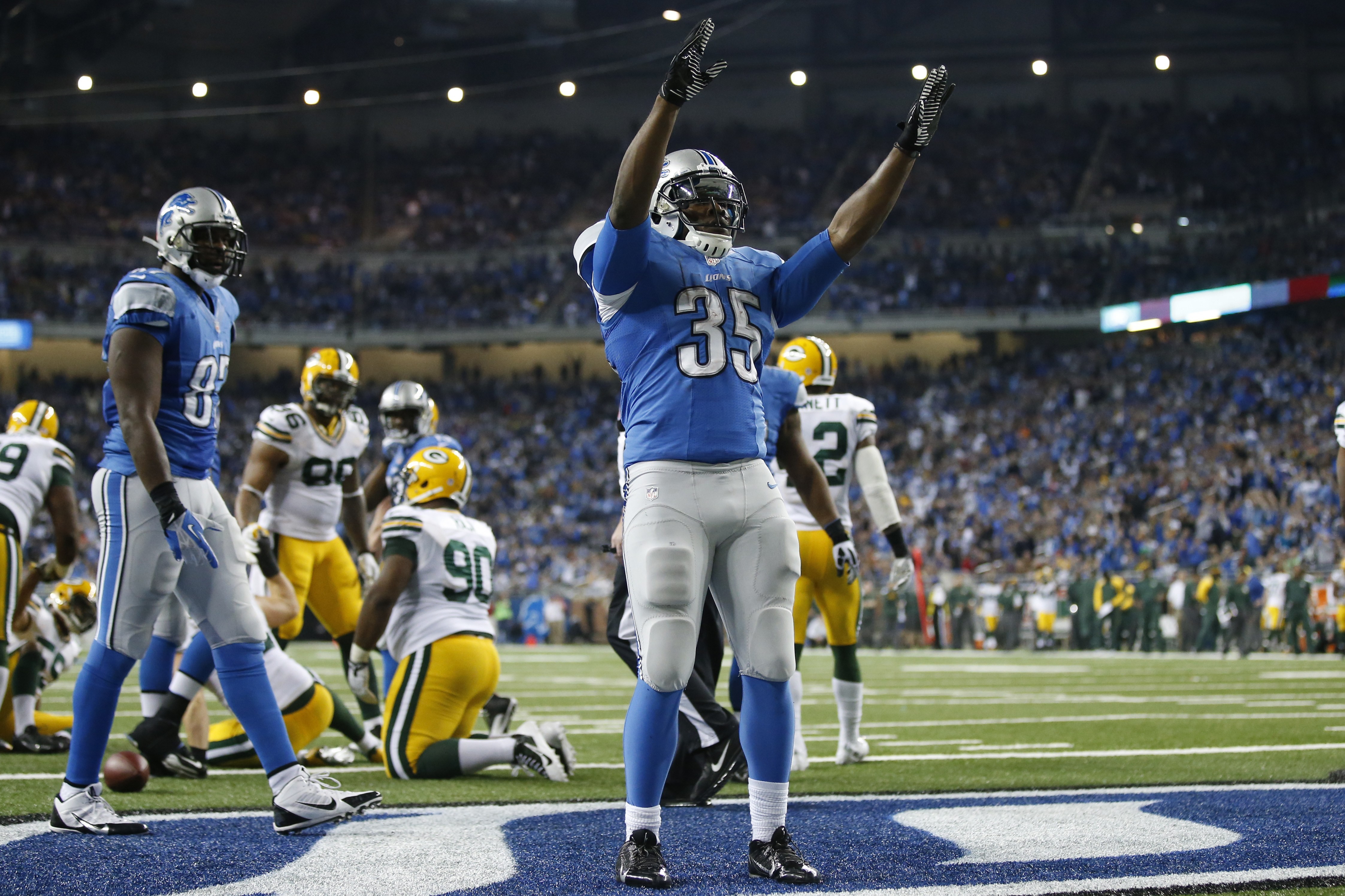 Detroit Lions running back Joique Bell (35) reacts after his touchdown during the fourth quarter of an NFL football game against the Green Bay Packers at Ford Field in Detroit, Thursday, Nov. 28, 2013. (AP Photo/Rick Osentoski)