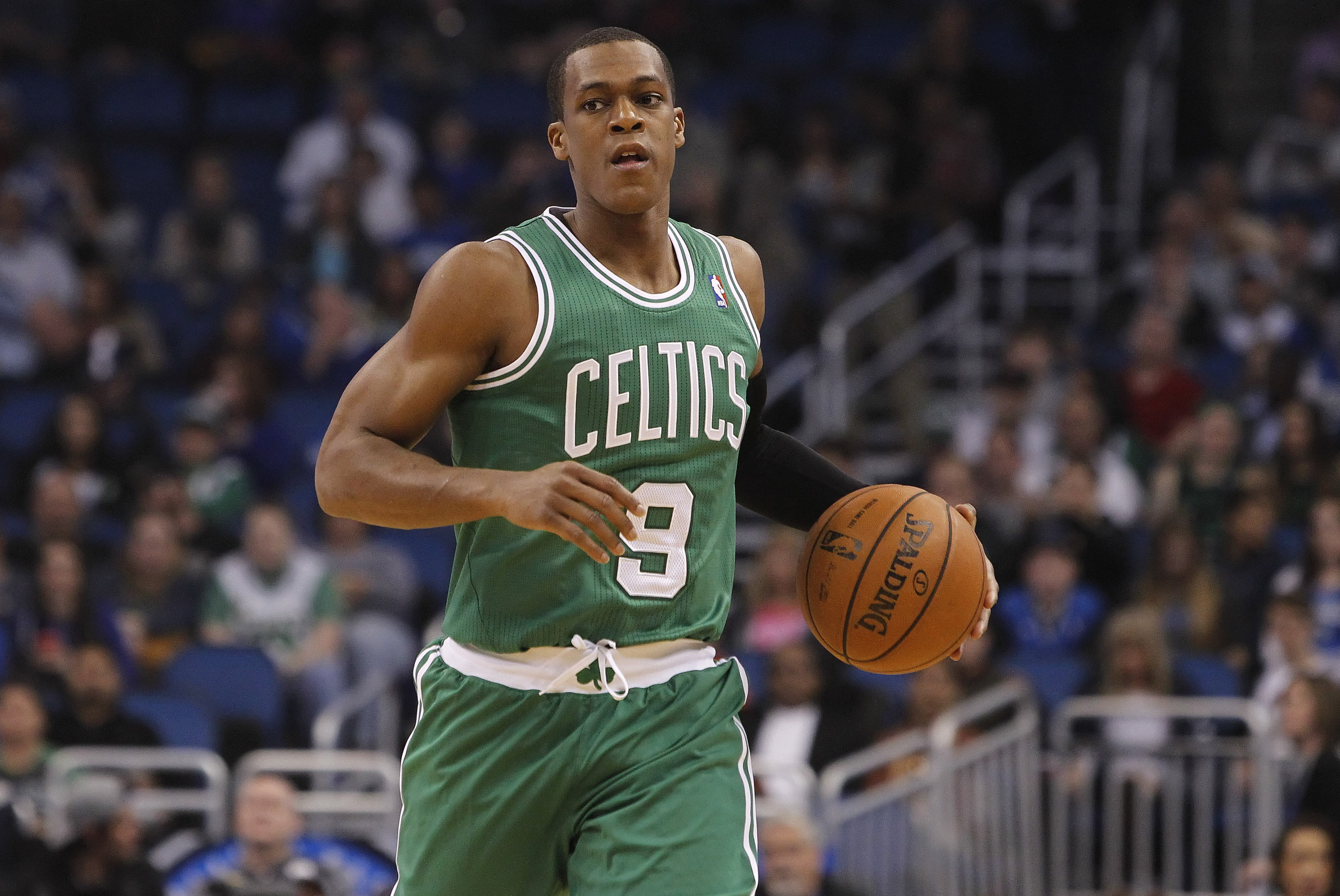 Jan 19, 2014; Orlando, FL, USA; Boston Celtics point guard Rajon Rondo (9) dribbles the ball against the Orlando Magic during the first quarter at Amway Center. Mandatory Credit: Kim Klement-USA TODAY Sports