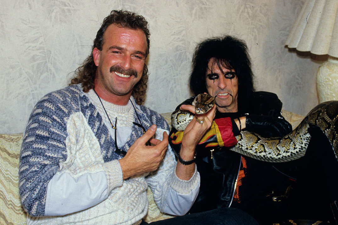 Jake Roberts with Alice Cooper.