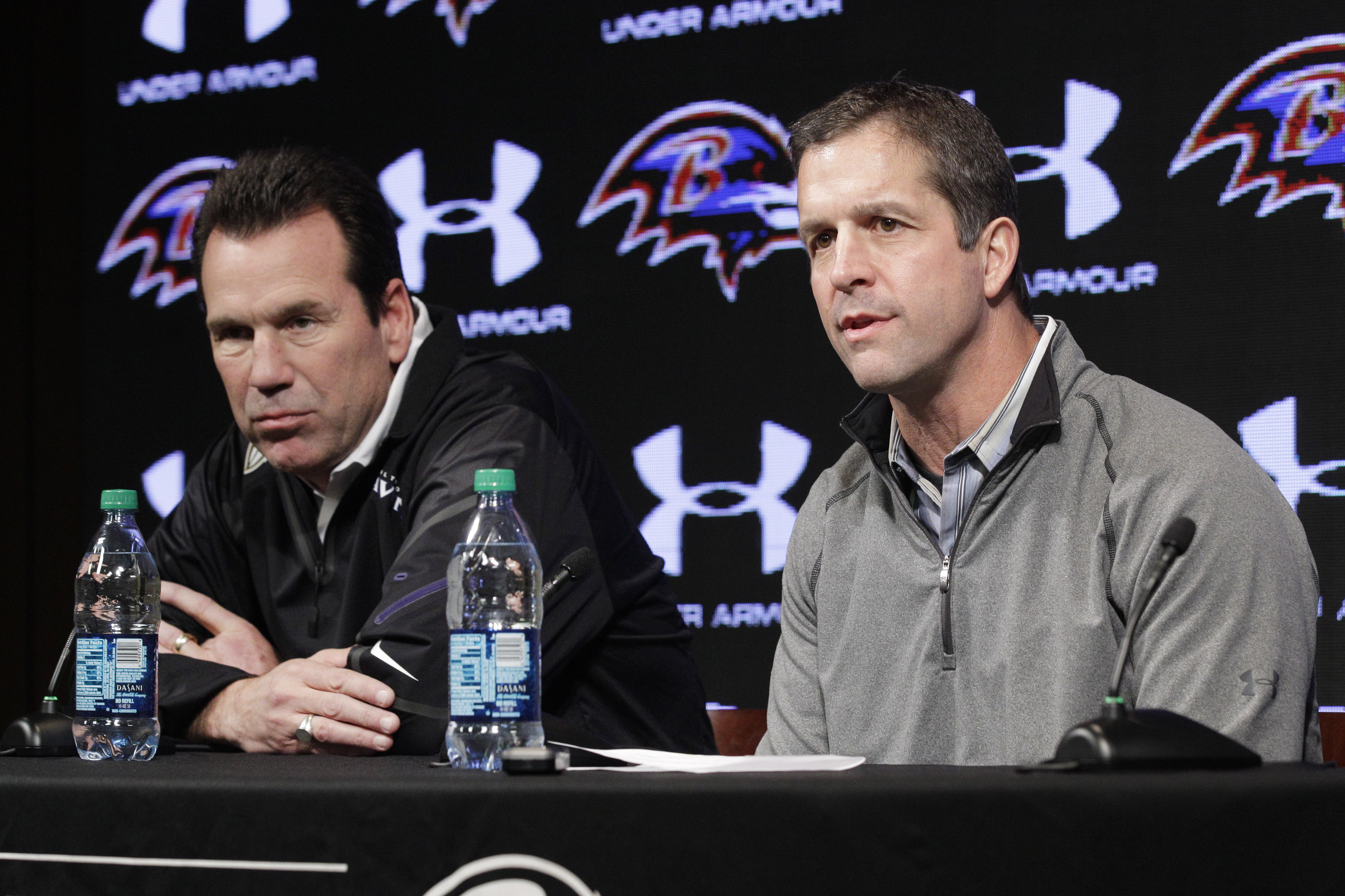 Baltimore Ravens offensive coordinator Gary Kubiak, left, listens as head coach John Harbaugh speaks at an introductory NFL football news conference, Monday, Jan. 27, 2014, in Owings Mills, Md. Kubiak, The former Houston Texans head coach replaces Jim Caldwell, who left to become coach of the Detroit Lions. (AP Photo/Patrick Semansky)