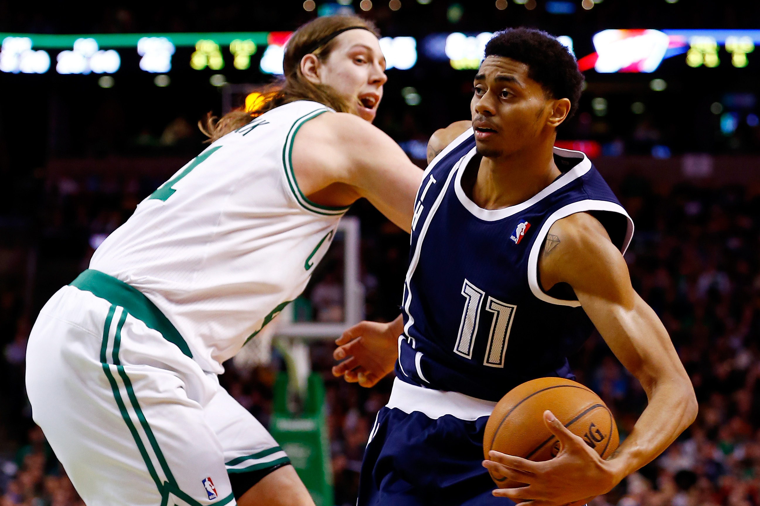 BOSTON, MA - JANUARY 24:  Jeremy Lamb #11 of the Oklahoma City Thunder goes to the basket as Kelly Olynyk #41 of the Boston Celtics defends during a game at the TD Garden on January 24, 2014 in Boston, Massachusetts. NOTE TO USER: User expressly acknowledges and agrees that, by downloading and/or using this photograph, user is consenting to the terms and conditions of the Getty Images License Agreement.  (Photo by Alex Trautwig/Getty Images)