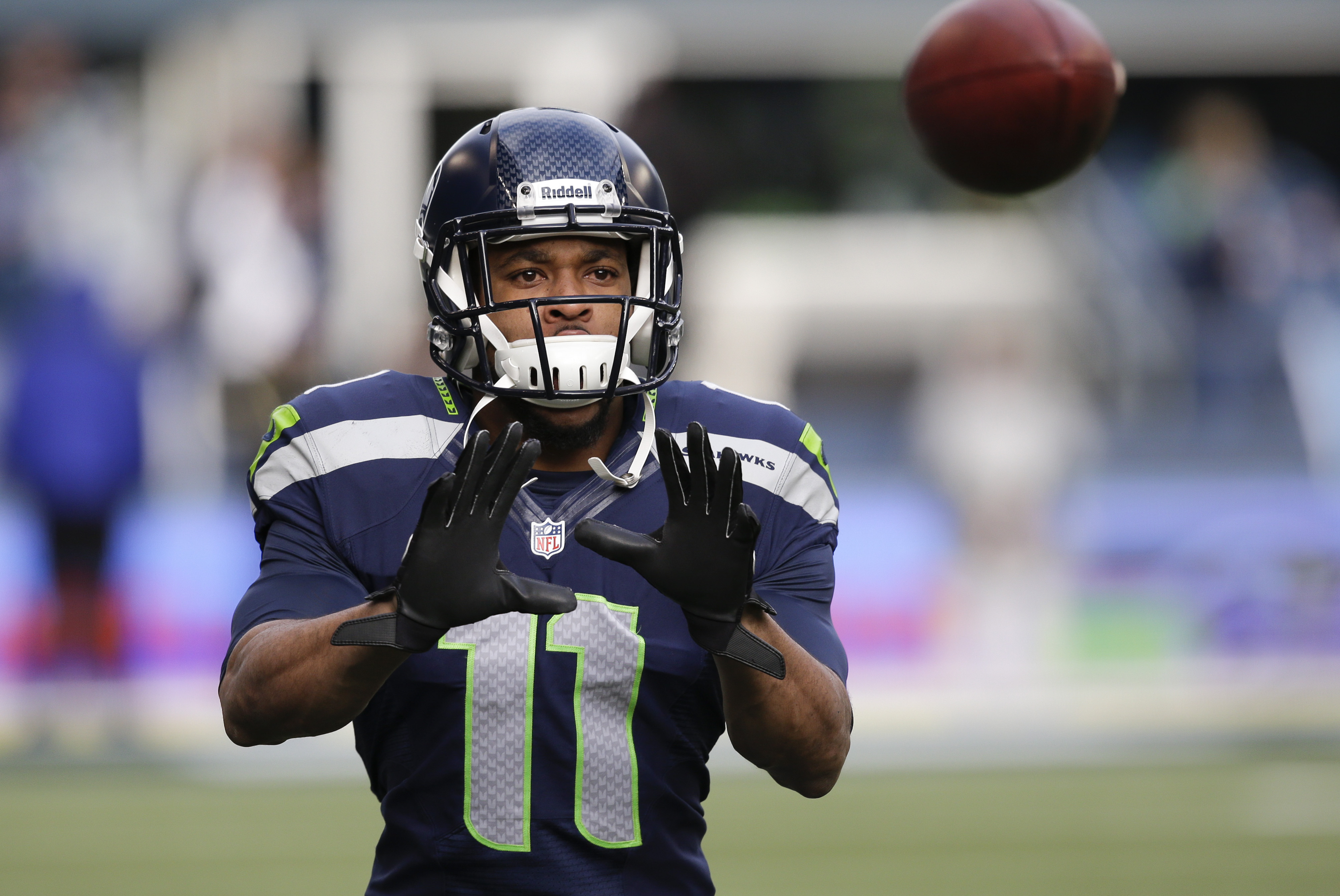 Seattle Seahawks wide receiver Percy Harvin warms up before an NFC divisional playoff NFL football game against the New Orleans Saints in Seattle, Saturday, Jan. 11, 2014. (AP Photo/Elaine Thompson)