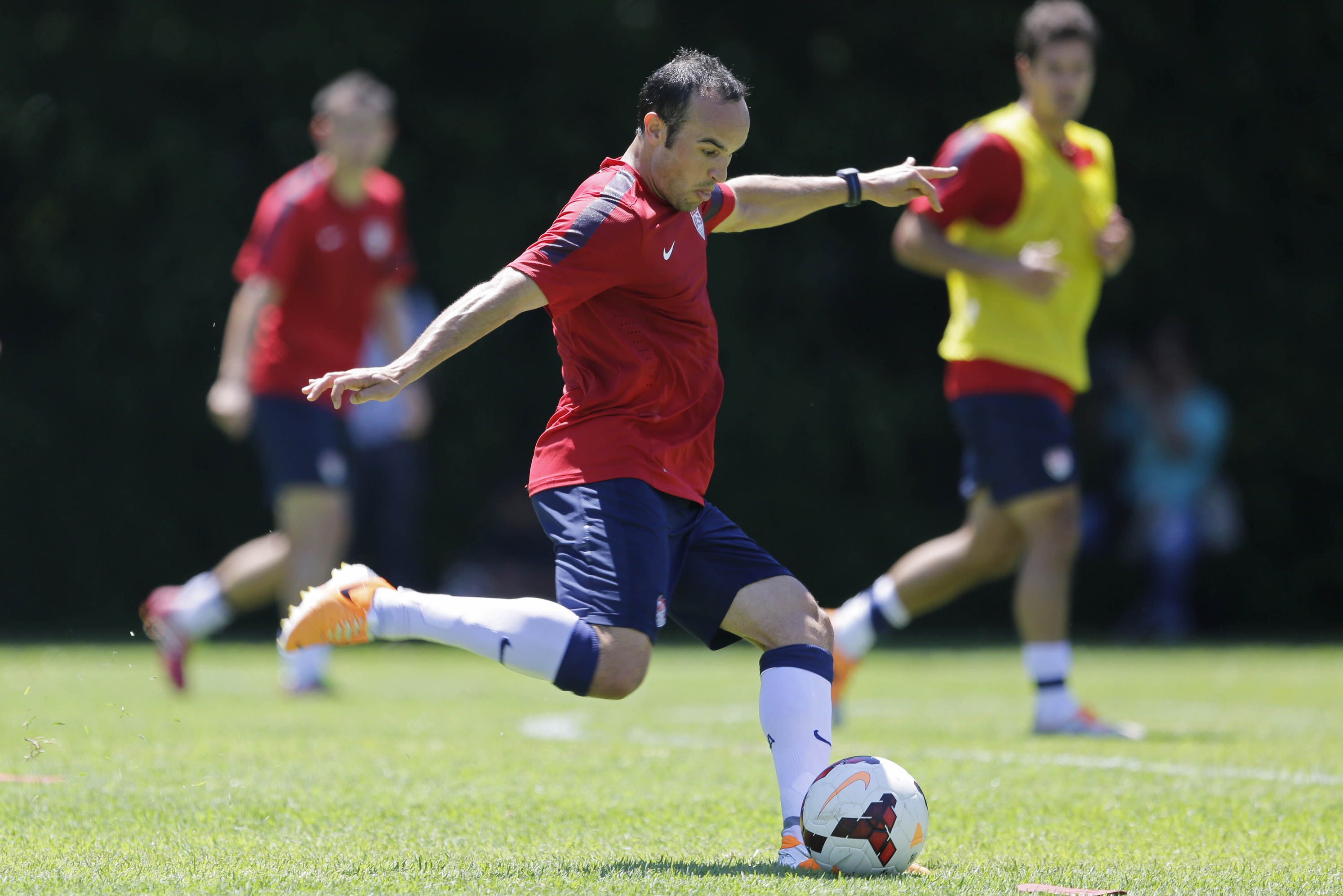 FILE - In this Jan. 22, 2014, file photo, United States' Landon Donovan kicks the ball during a soccer training session in Sao Paulo. Donovan and the U.S. soccer team are back home after a 12-day camp in Brazil, and they're ready to start figuring out how the pieces will fit at the World Cup. Even with several key players, in Europe, coach Jurgen Klinsmann hopes to learn a little more in Saturday's exhibition against South Korea. (AP Photo/Nelson Antoine, File)