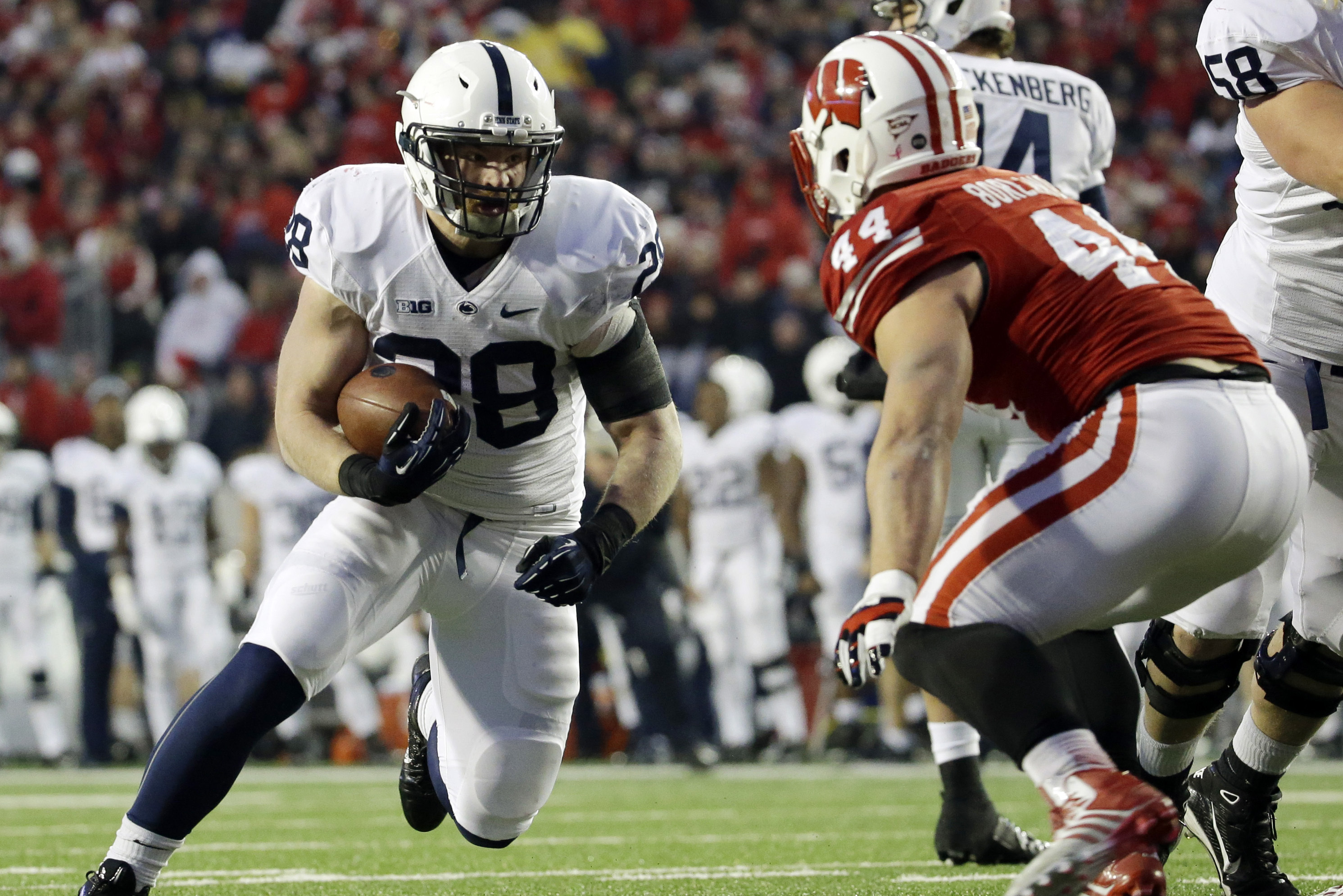 Penn State's Zach Zwinak, left, tries to run past Wisconsin's Chris Borland (44) during the second half of an NCAA college football game on Saturday, Nov. 30, 2013, in Madison, Wis. Penn State won 31-24. (AP Photo/Morry Gash)