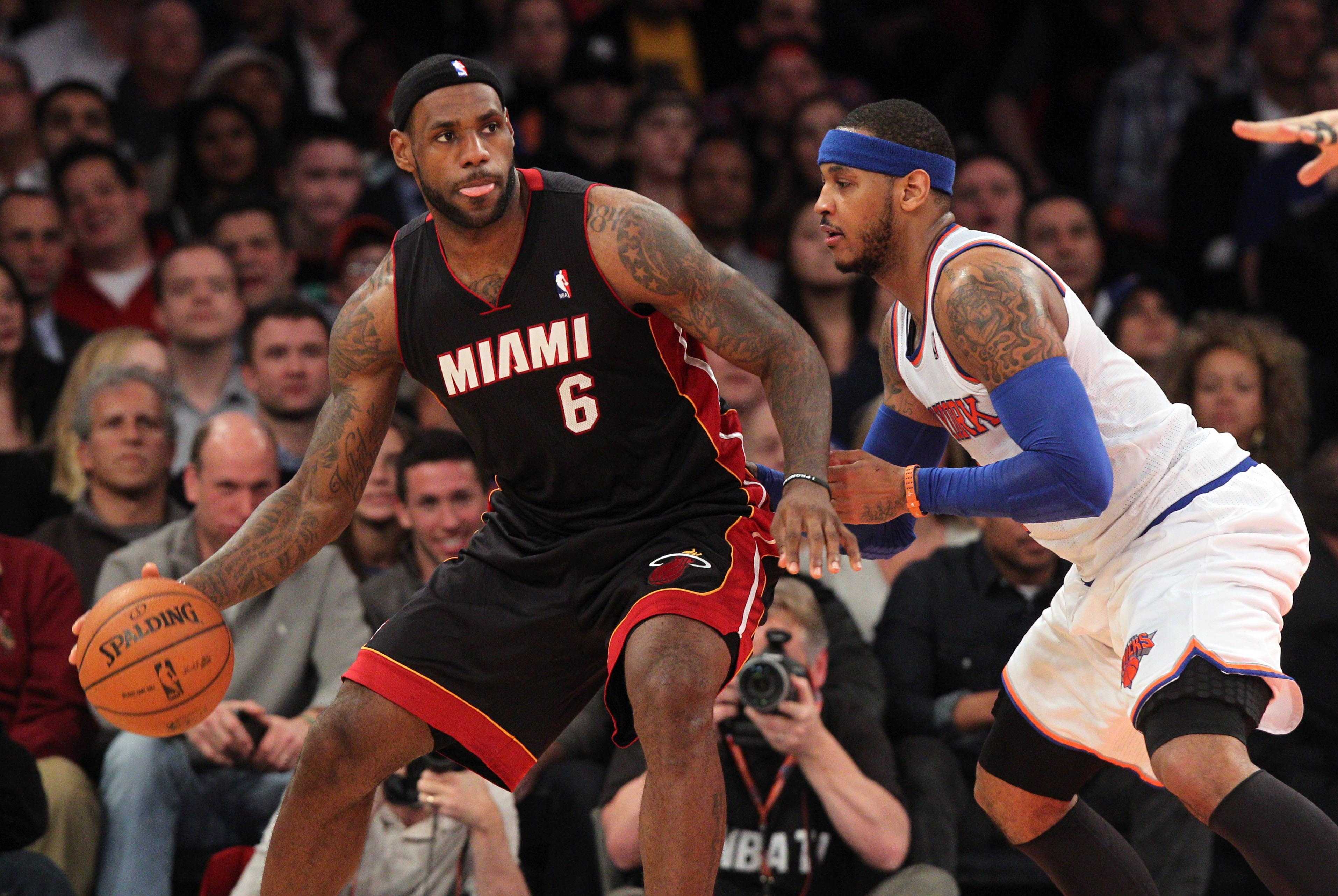 Jan 9, 2014; New York, NY, USA; Miami Heat small forward LeBron James (6) controls the ball against New York Knicks small forward Carmelo Anthony (7) during the fourth quarter of a game at Madison Square Garden. Mandatory Credit: Brad Penner-USA TODAY Sports