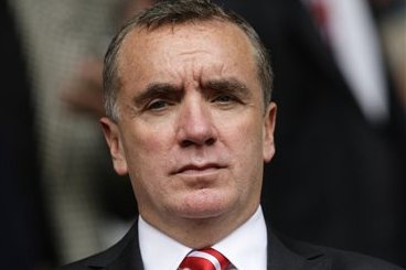 Liverpool's managing director Ian Ayre takes his seat before his team's English Premier League soccer match against Arsenal at Anfield Stadium, Liverpool, England, Sunday, Sept. 2, 2012. (AP Photo/Jon Super)