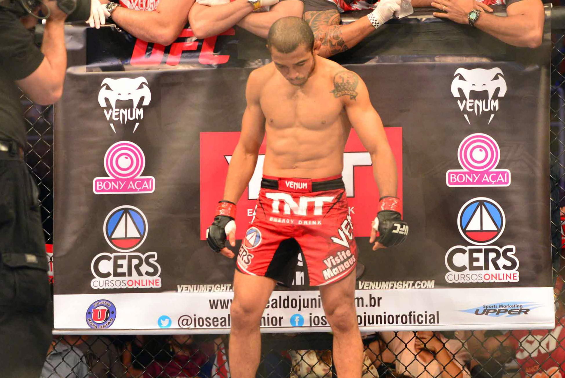 Aug 3, 2013; Rio De Janeiro, Brazil; Jose Aldo (red gloves) in his corner during his fight against Chan Sung Jung during UFC 163 at HSBC Arena. Mandatory Credit: Jason Silva-USA TODAY Sports
