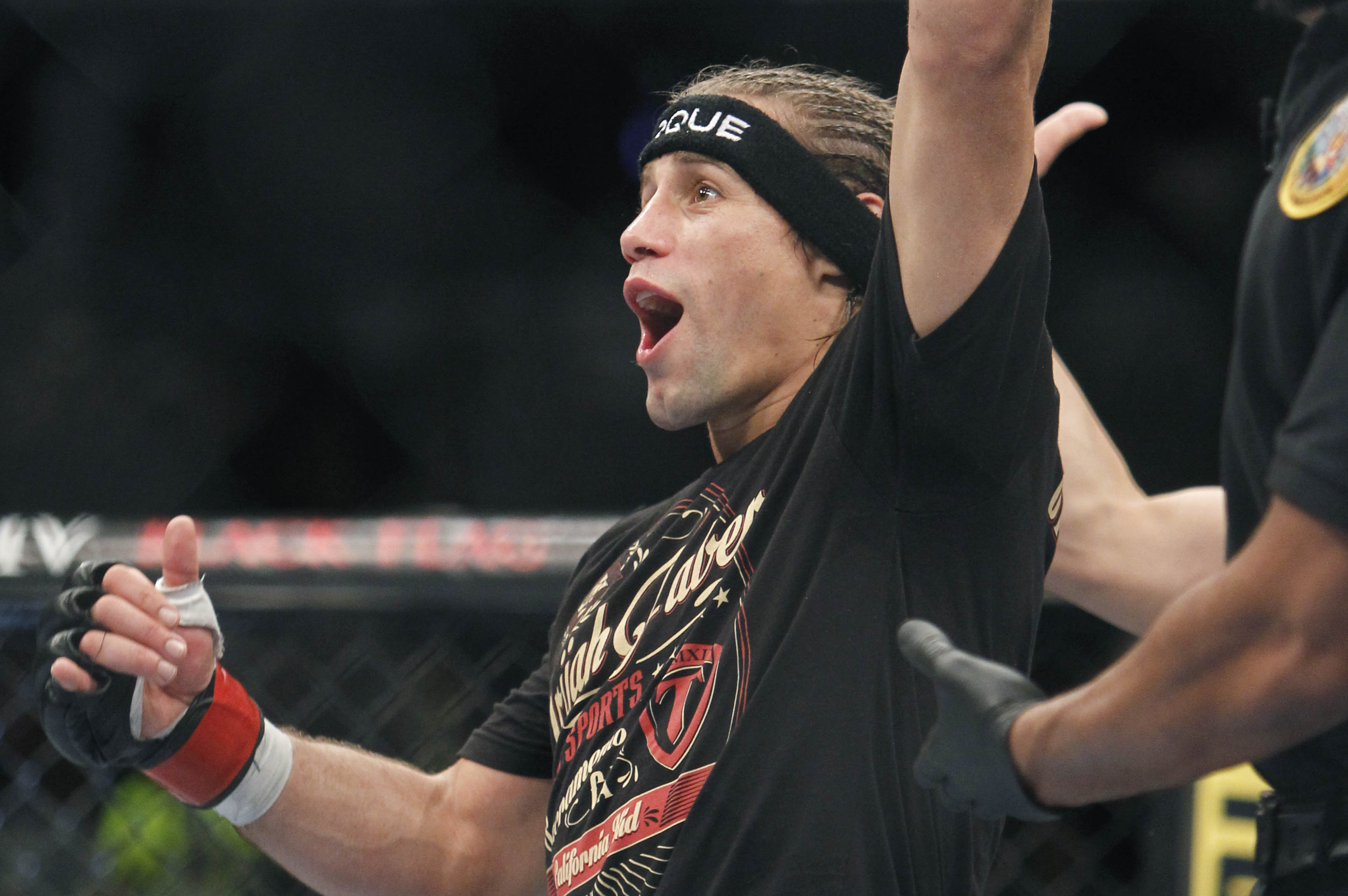 Urijah Faber celebrates his win over Michael McDonald in a UFC Mixed Martial Arts bantamweight fight in Sacramento, Calif., on Saturday, Dec. 14, 2013.(AP Photo/Steve Yeater)