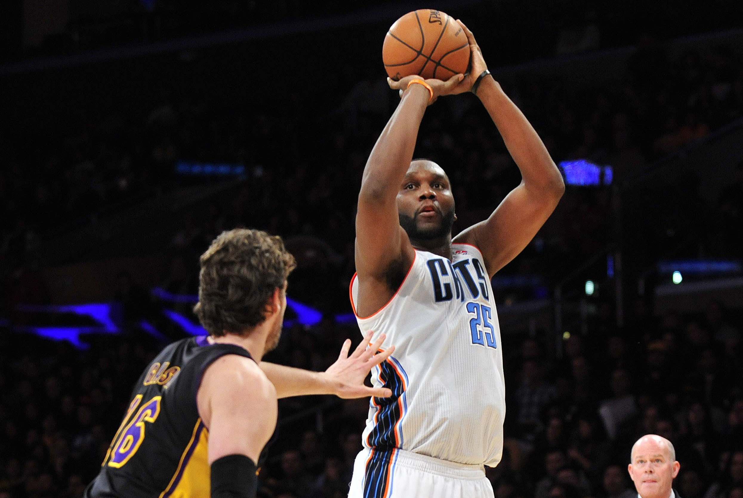 January 31, 2014; Los Angeles, CA, USA; Charlotte Bobcats center Al Jefferson (25) shoots a basket against the defense of Los Angeles Lakers center Pau Gasol (16) during the first half at Staples Center. Mandatory Credit: Gary A. Vasquez-USA TODAY Sports