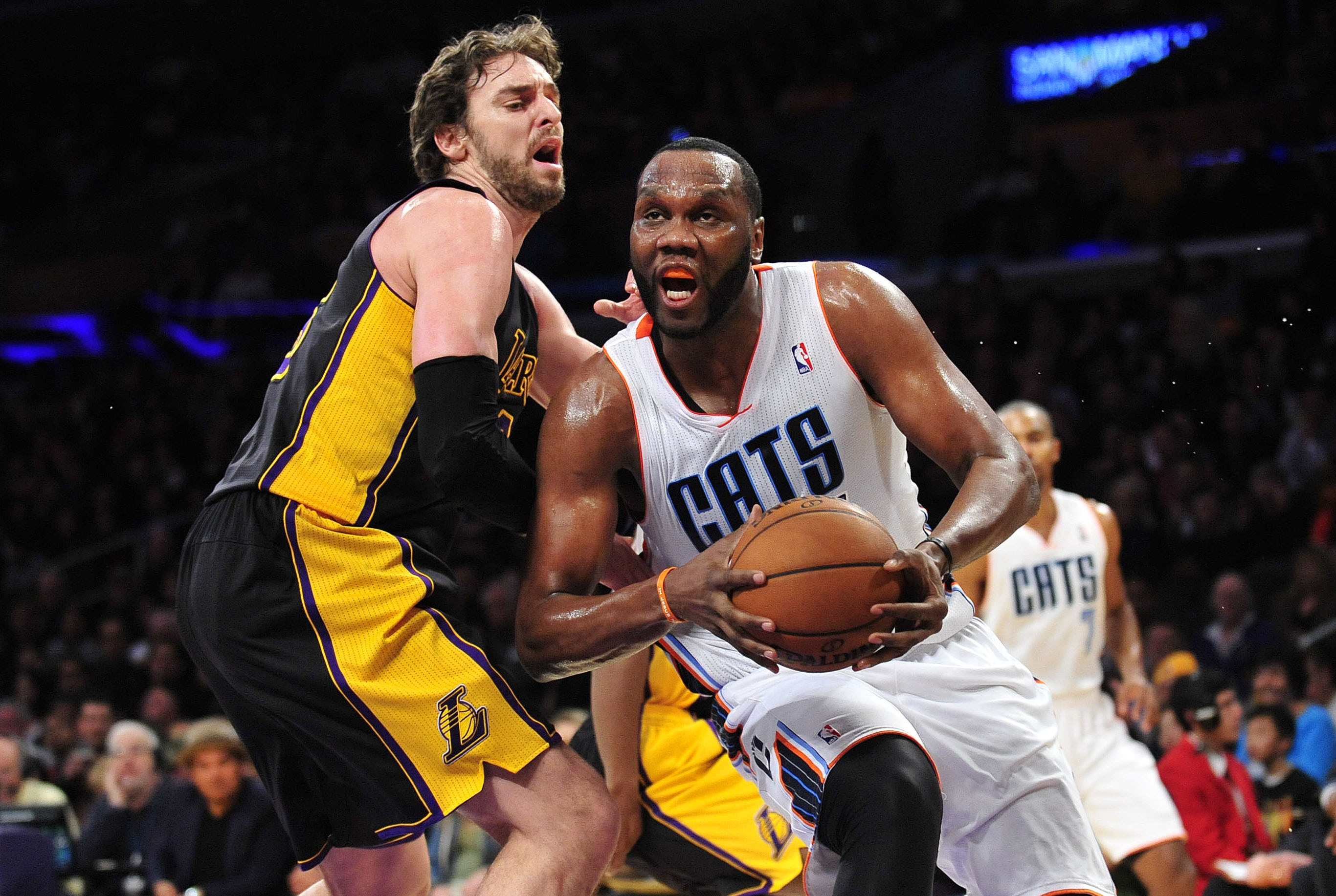 January 31, 2014; Los Angeles, CA, USA; Charlotte Bobcats center Al Jefferson (25) moves to the basket against the defense of Los Angeles Lakers center Pau Gasol (16) during the first half at Staples Center. Mandatory Credit: Gary A. Vasquez-USA TODAY Sports