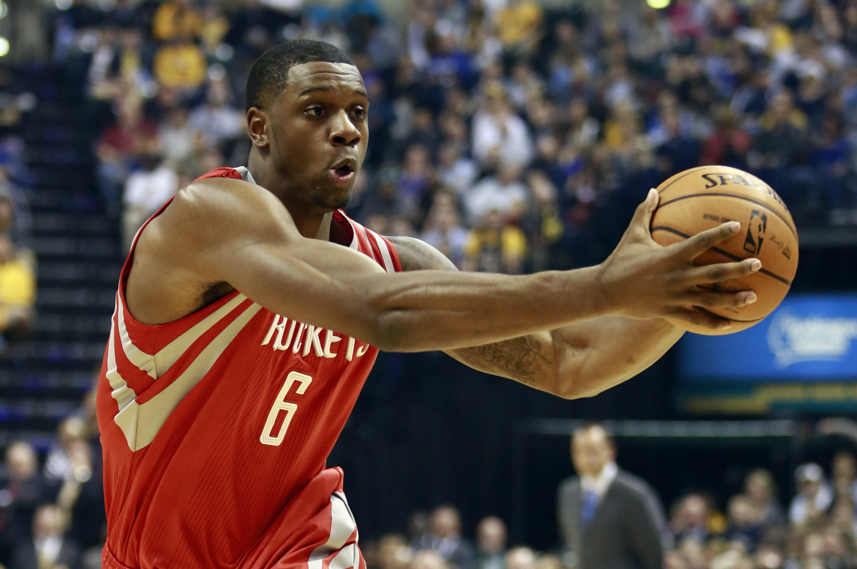 Houston Rockets forward Terrence Jones fakes a pass against the Indiana Pacers in the first half of an NBA basketball game in Indianapolis, Friday, Dec. 20, 2013. (AP Photo/R Brent Smith)