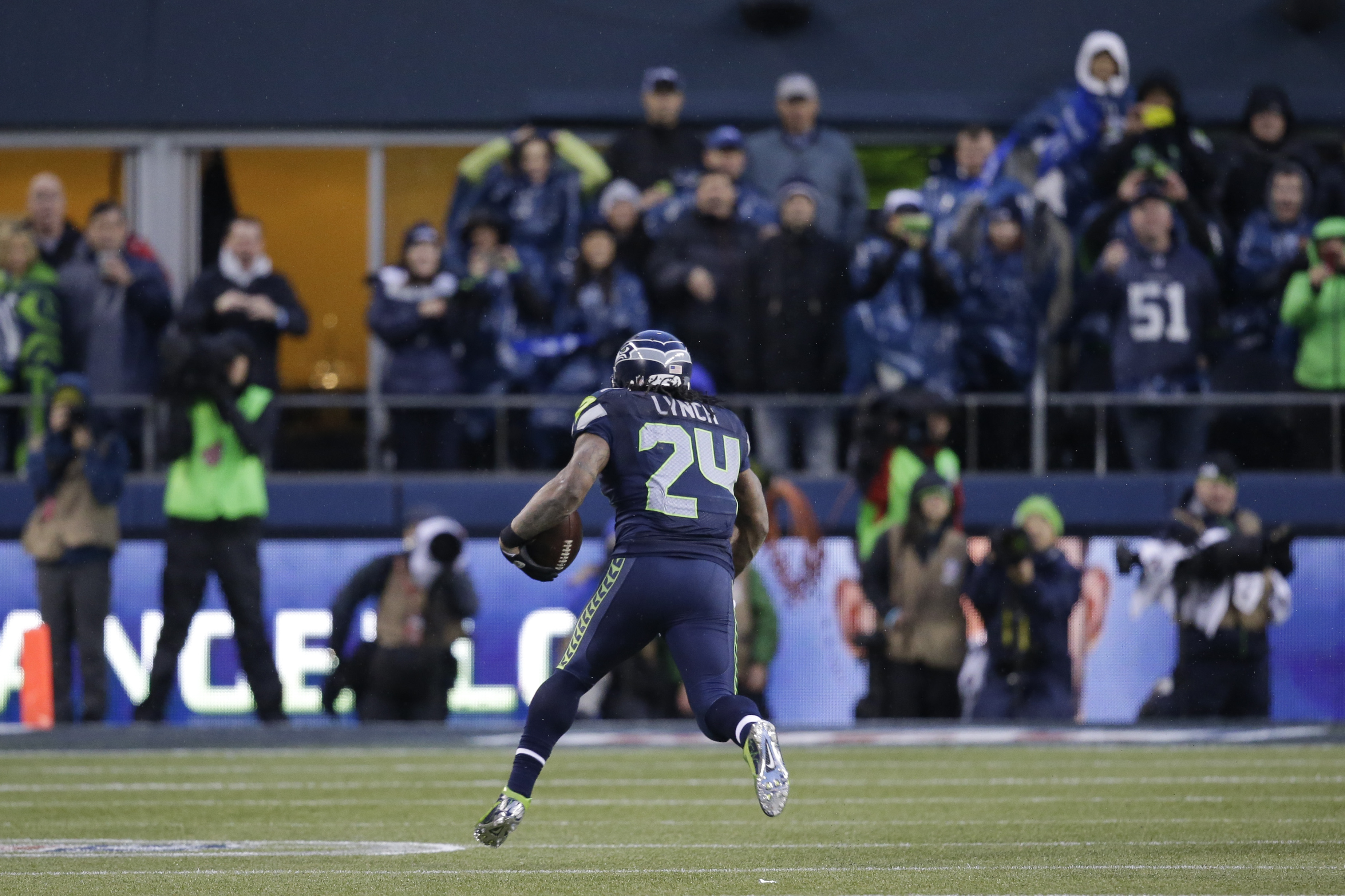 Seattle Seahawks running back Marshawn Lynch runs for a 31-yard touchdown against the New Orleans Saints during the fourth quarter of an NFC divisional playoff NFL football game in Seattle, Saturday, Jan. 11, 2014. (AP Photo/Elaine Thompson)