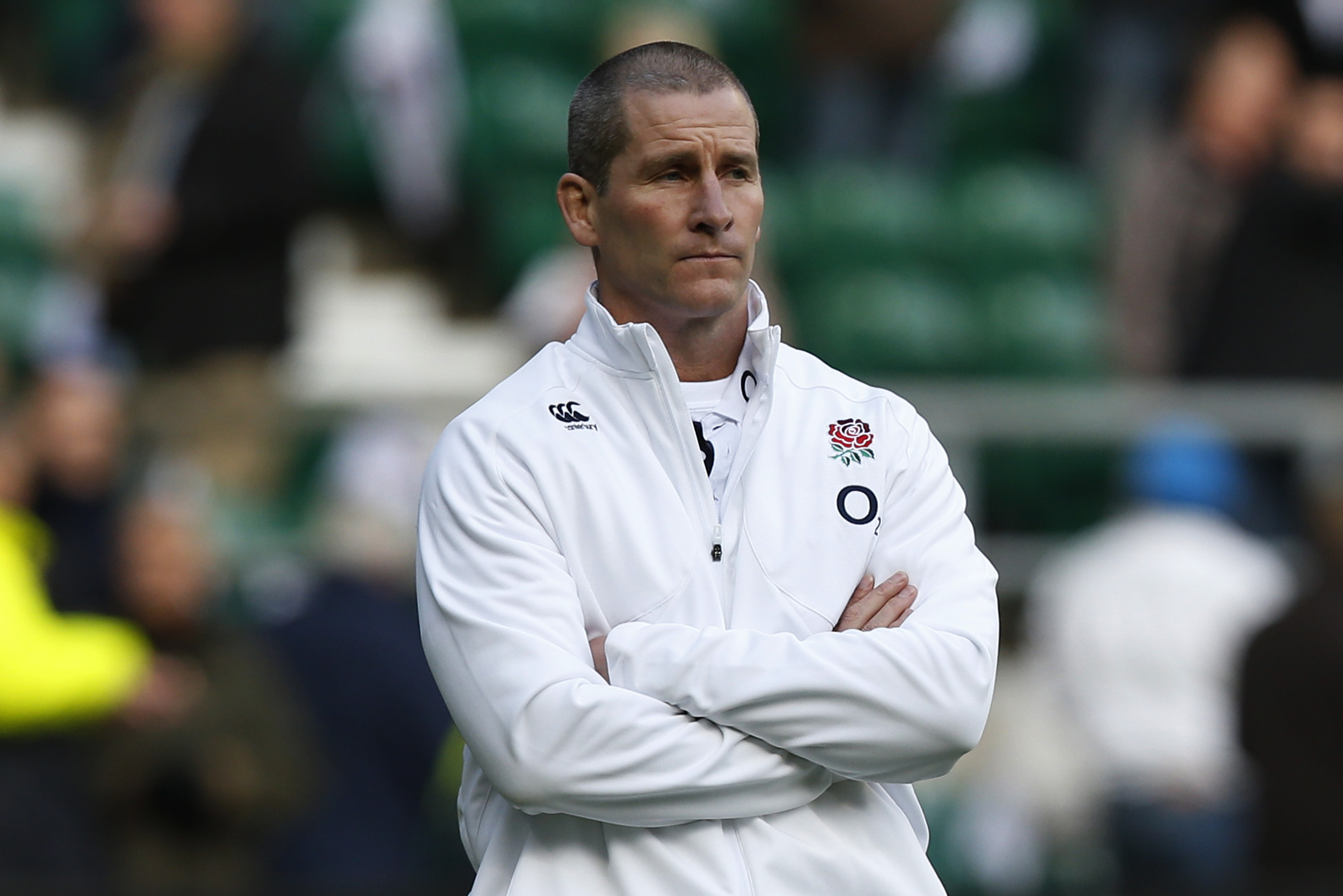 England's head coach Stuart Lancaster watches his team warm up before the start of  their autumn international rugby match against New Zealand at Twickenham Stadium in London, Saturday, Nov. 16, 2013. (AP Photo/Sang Tan)