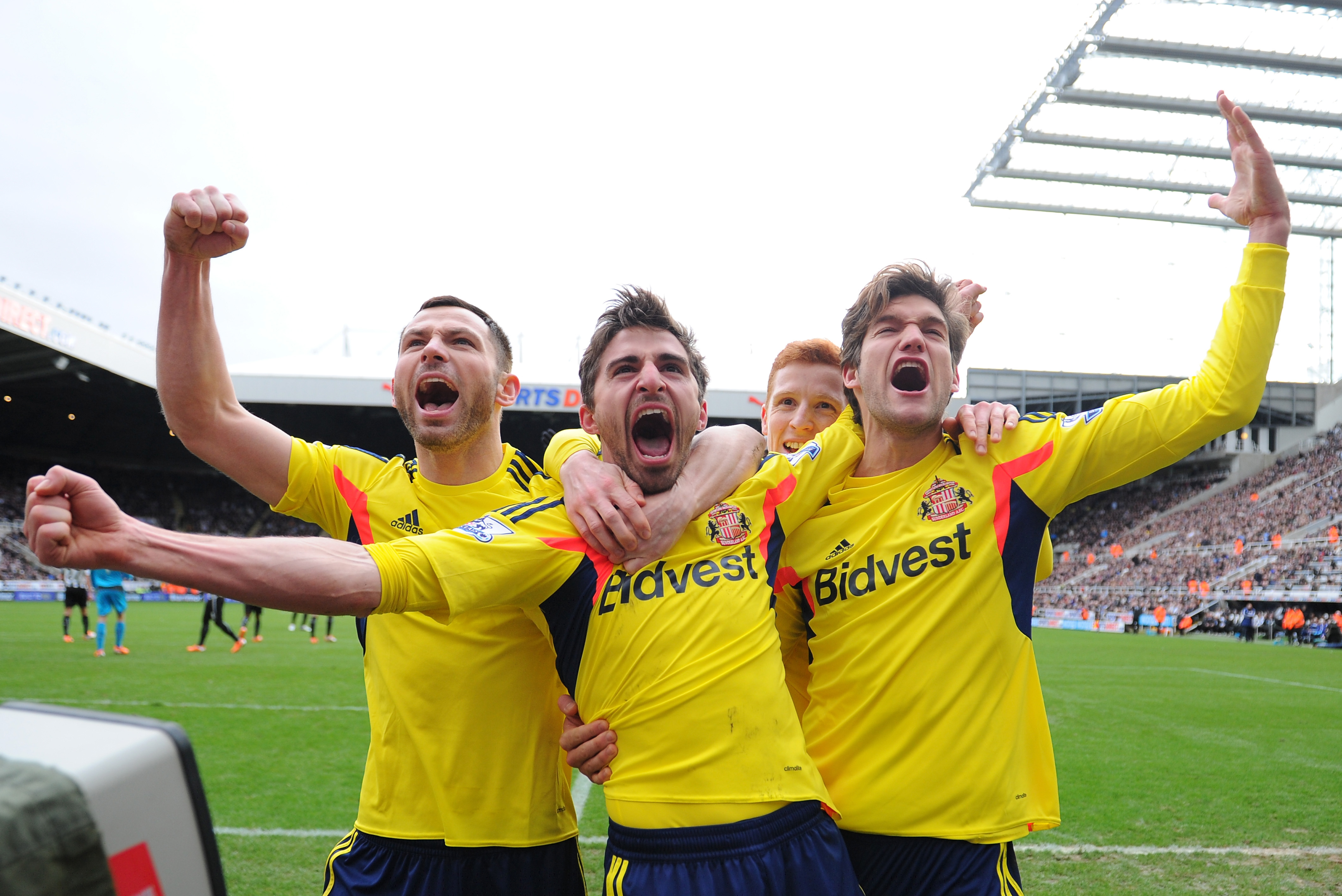 NEWCASTLE UPON TYNE, ENGLAND - FEBRUARY 01:  Fabio Borini (C) of Sunderland celebrates with teammates Phil Bardsley (L) and Marcos Alonso (R) after scoring the opening goal during the Barclays Premier League match between Newcastle United and Sunderland at St James' Park on February 1, 2014 in Newcastle upon Tyne, England.  (Photo by Michael Regan/Getty Images)