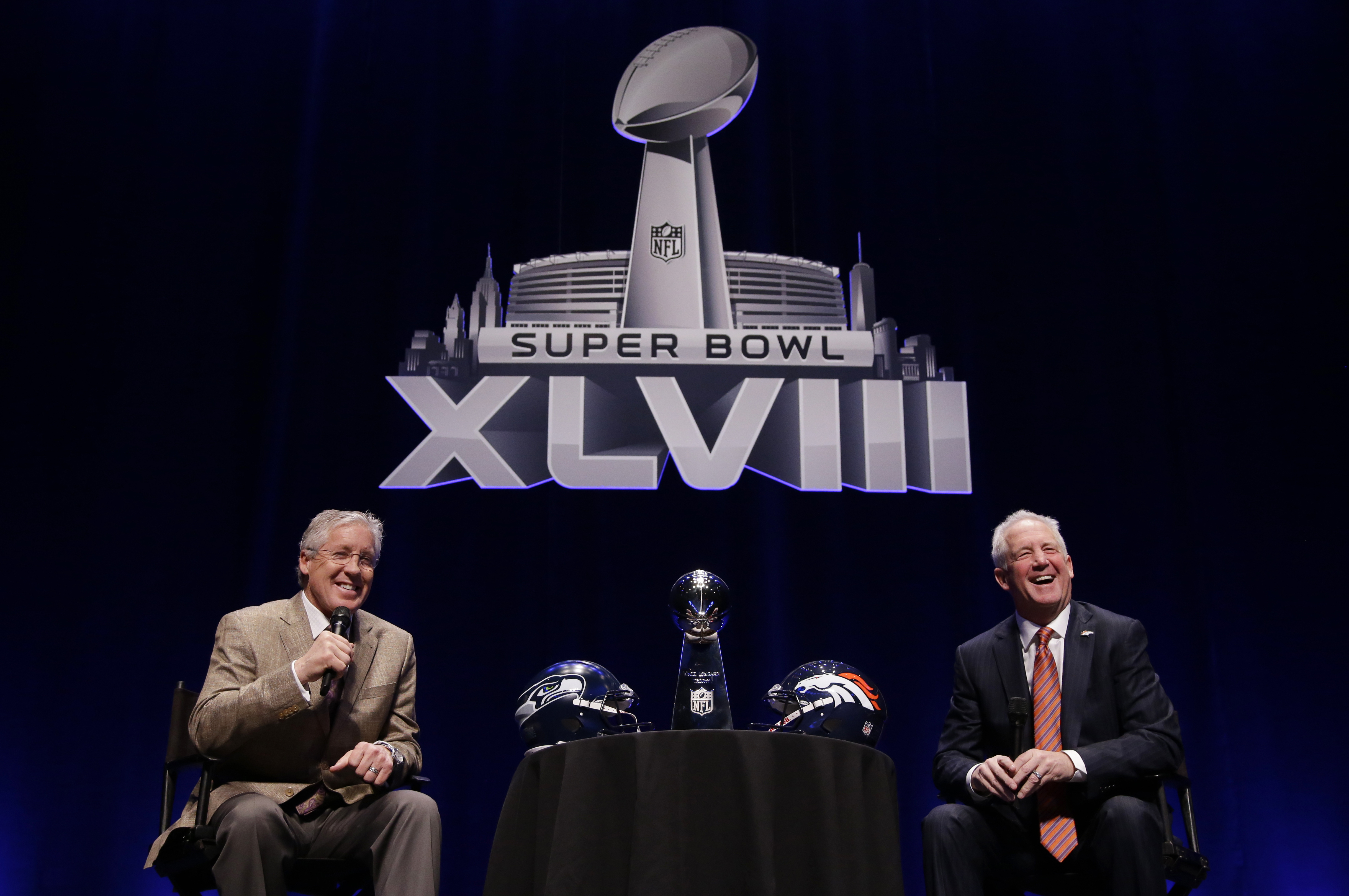 Seattle Seahawks head coach Pete Carroll and Denver Broncos head coach John Fox speak at a news conference Friday, Jan. 31, 2014, in New York. The Seahawks and the Broncos are scheduled to play in the NFL Super Bowl XLVIII football game on Sunday, Feb. 2, at MetLife Stadium in East Rutherford, N.J. (AP Photo/Matt Slocum)