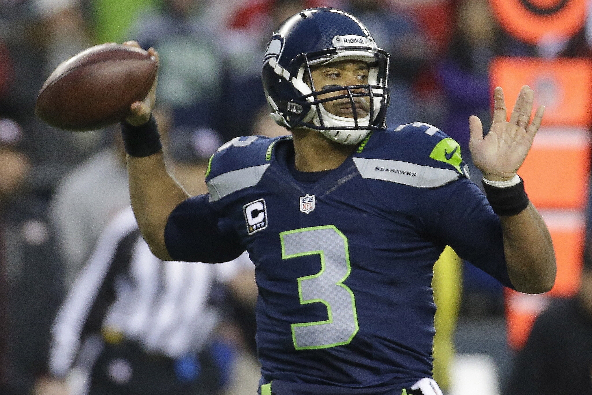 Seattle Seahawks' Russell Wilson throws during the first half of the NFL football NFC Championship game against the San Francisco 49ers, Sunday, Jan. 19, 2014, in Seattle. (AP Photo/Ted S. Warren)