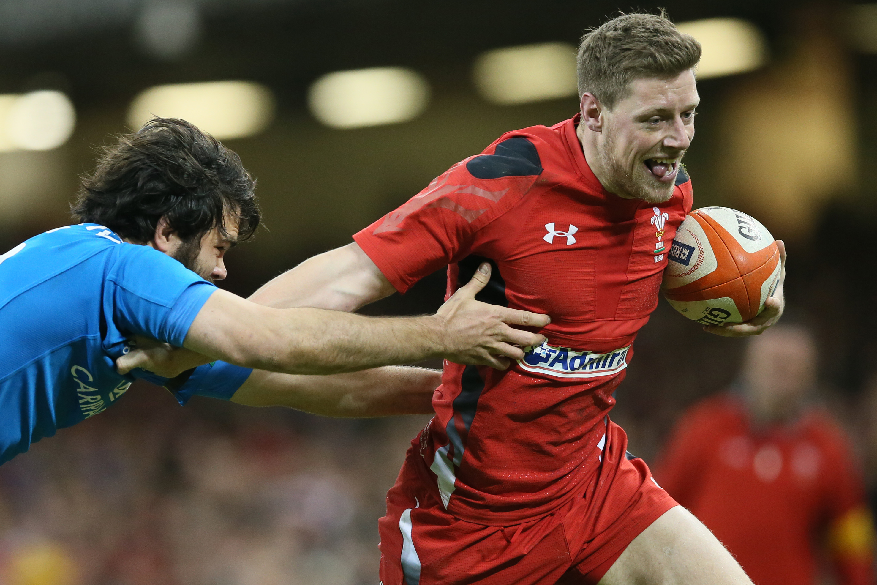 Wales's Rhys Priestland, right, gets away from Italy's Luke McLean during their Six Nations international rugby union match between Wales and Italy at the Millennium stadium in Cardiff, Wales, Saturday, Feb. 1, 2014. (AP Photo/Alastair Grant)