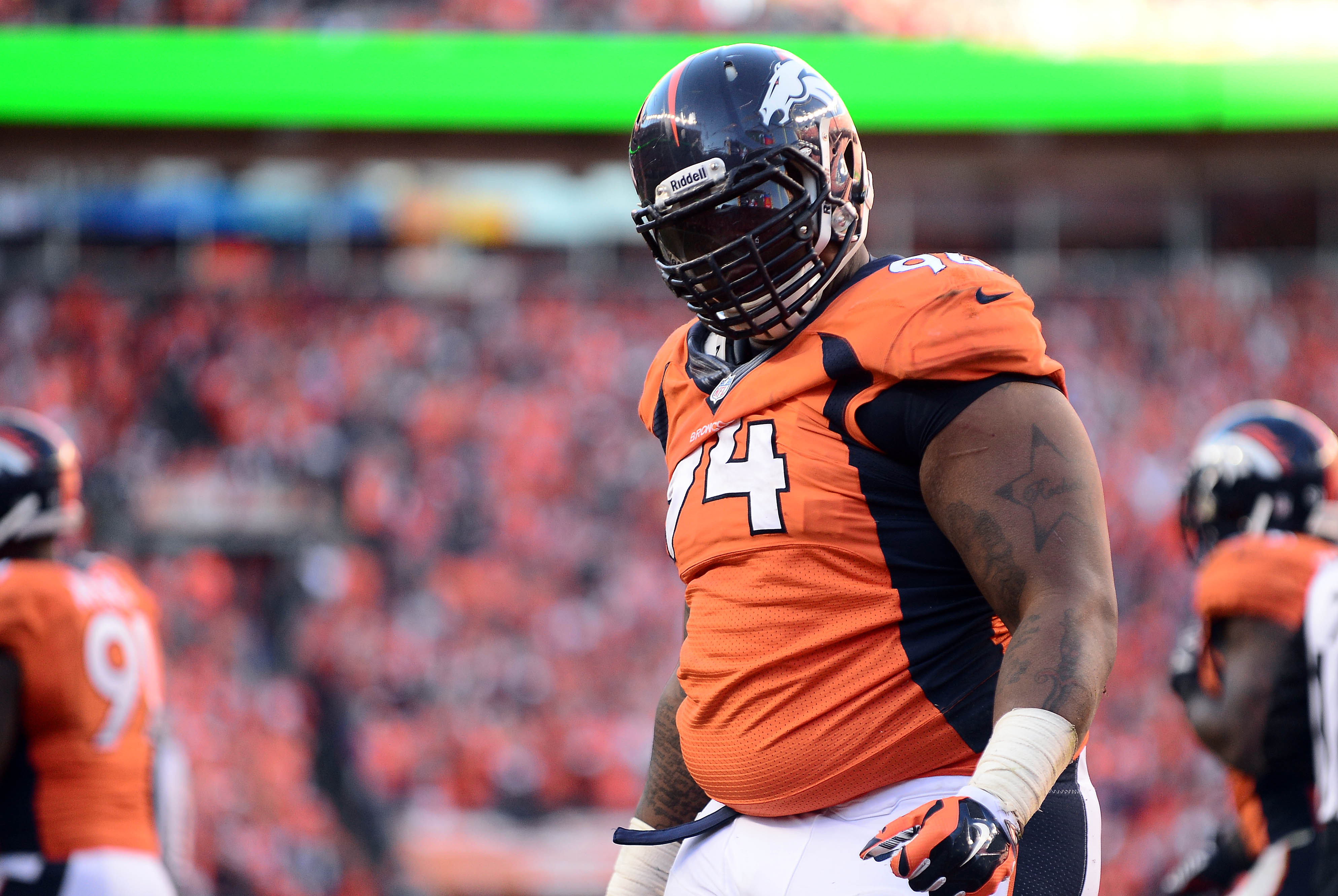 January 19, 2014; Denver, CO, USA; Denver Broncos defensive tackle Terrance Knighton (94) celebrates after sacking New England Patriots quarterback Tom Brady (12) in the second half of the 2013 AFC Championship football game at Sports Authority Field at Mile High.  Mandatory Credit: Ron Chenoy-USA TODAY Sports