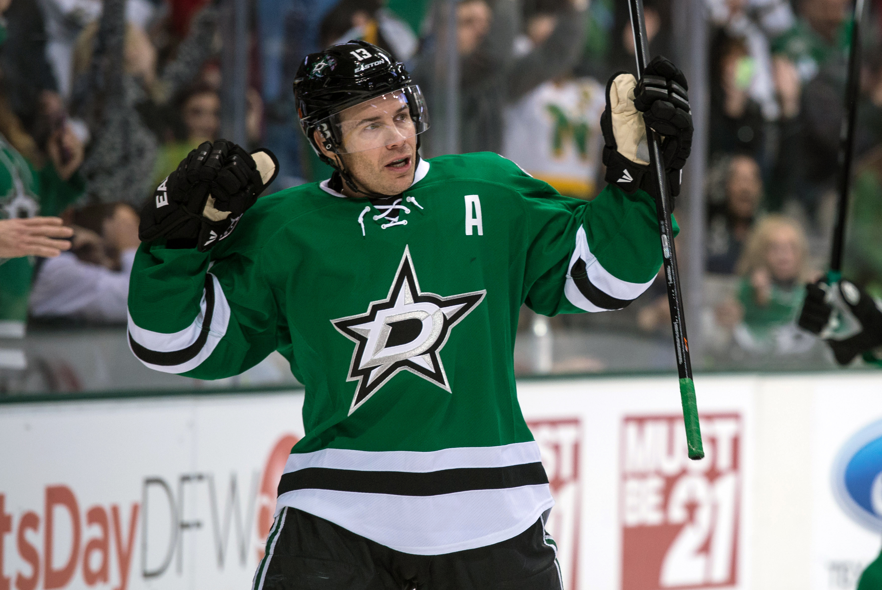 Jan 21, 2014; Dallas, TX, USA; Dallas Stars left wing Ray Whitney (13) celebrates his goal against Minnesota Wild goalie Darcy Kuemper (not pictured) during the second period at the American Airlines Center. Mandatory Credit: Jerome Miron-USA TODAY Sports
