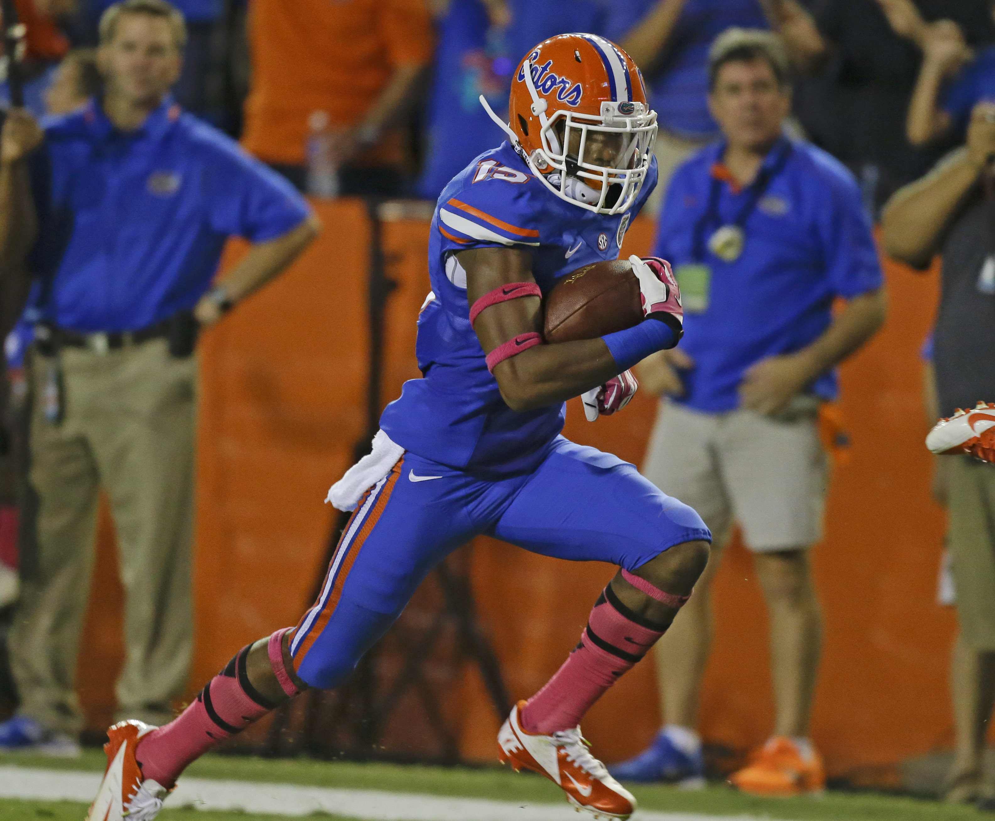 Florida defensive back Loucheiz Purifoy (15) runs for a 42-yard touchdown after intercepting an Arkansas pass during the first half of an NCAA college football game in Gainesville, Fla., Saturday, Oct. 5, 2013.(AP Photo/John Raoux)