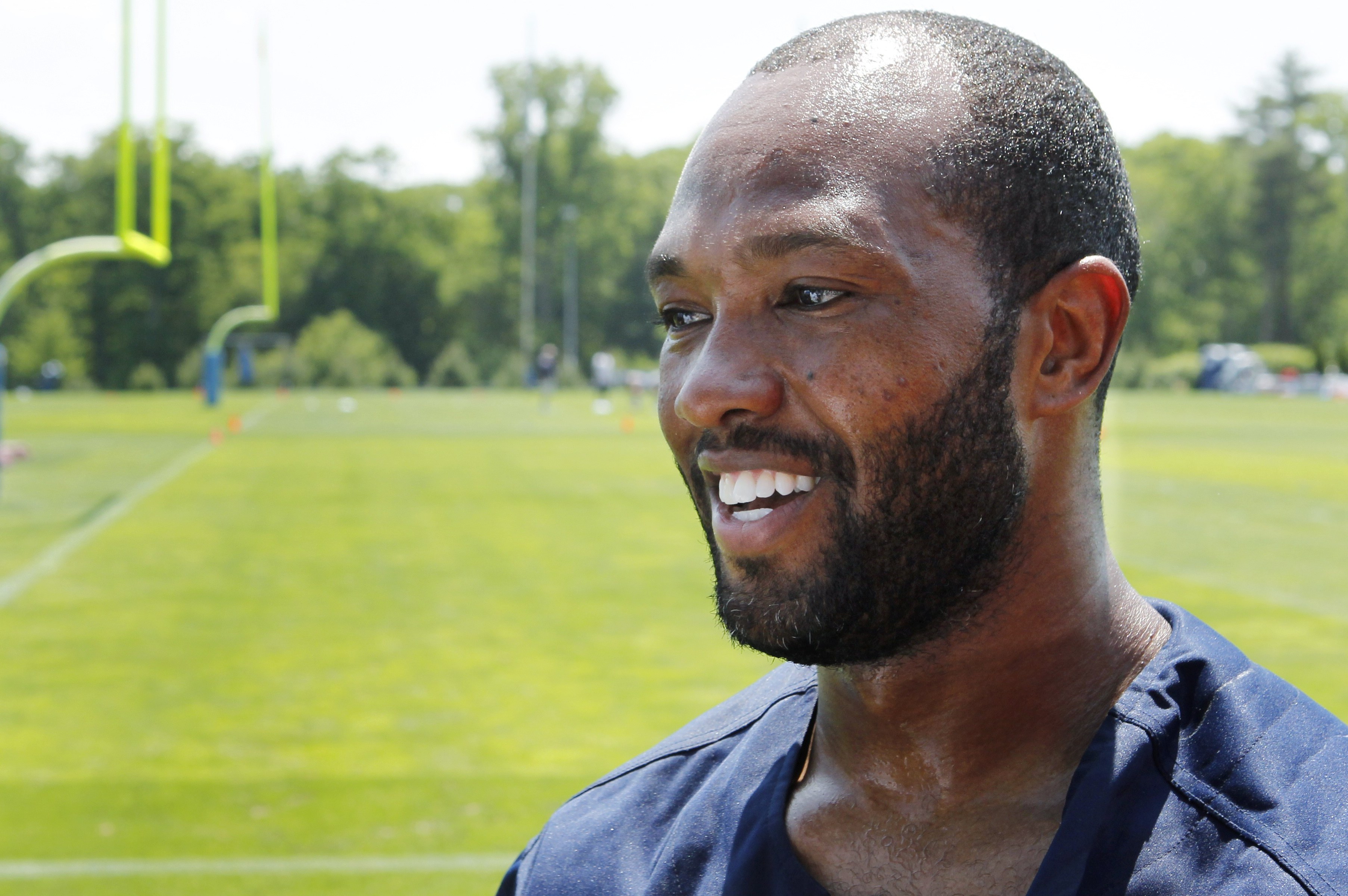 New England Patriots veteran wide receiver Torry Holt answers a question following NFL football practice in Foxborough, Mass., Wednesday, May 26, 2010. (AP Photo/Charles Krupa)