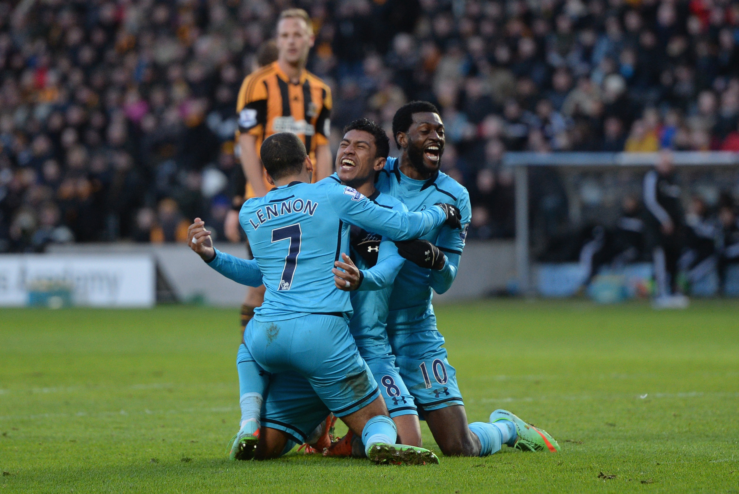 HULL, ENGLAND - FEBRUARY 01:  Paulinho (C) of Tottenham Hotspur celebrates scoring a goal with his team-mates Aaron Lennon and Emmanuel Adebayor during the Barclays Premier League match between Hull City and Tottenham Hotspur at KC Stadium on February 1, 2014 in Hull, England.  (Photo by Gareth Copley/Getty Images)