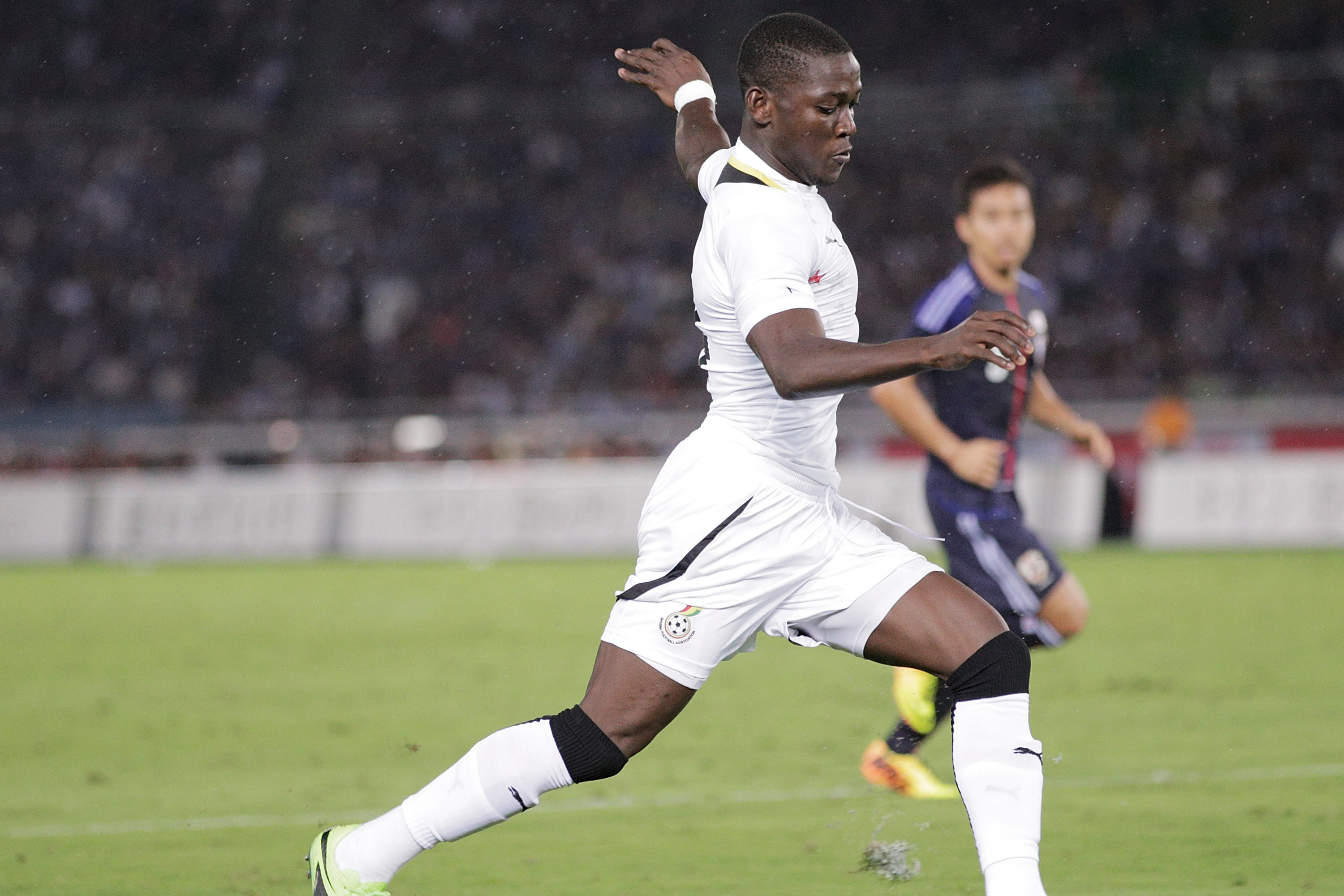 YOKOHAMA, JAPAN - SEPTEMBER 10:  Daniel Opare of Ghana takes a shot during the international friendly match between Japan and Ghana at International Stadium Yokohama on September 10, 2013 in Yokohama, Japan.  (Photo by Adam Pretty/Getty Images)