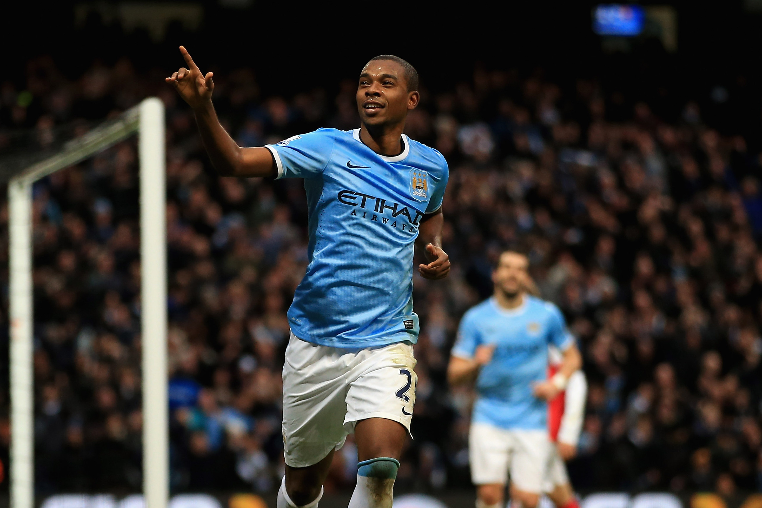 MANCHESTER, ENGLAND - DECEMBER 14:  Fernandinho of Manchester City celebrates scoring their fifth goal past Wojciech Szczesny of Arsenal during the Barclays Premier League match between Manchester City and Arsenal at Etihad Stadium on December 14, 2013 in Manchester, England.  (Photo by Richard Heathcote/Getty Images)