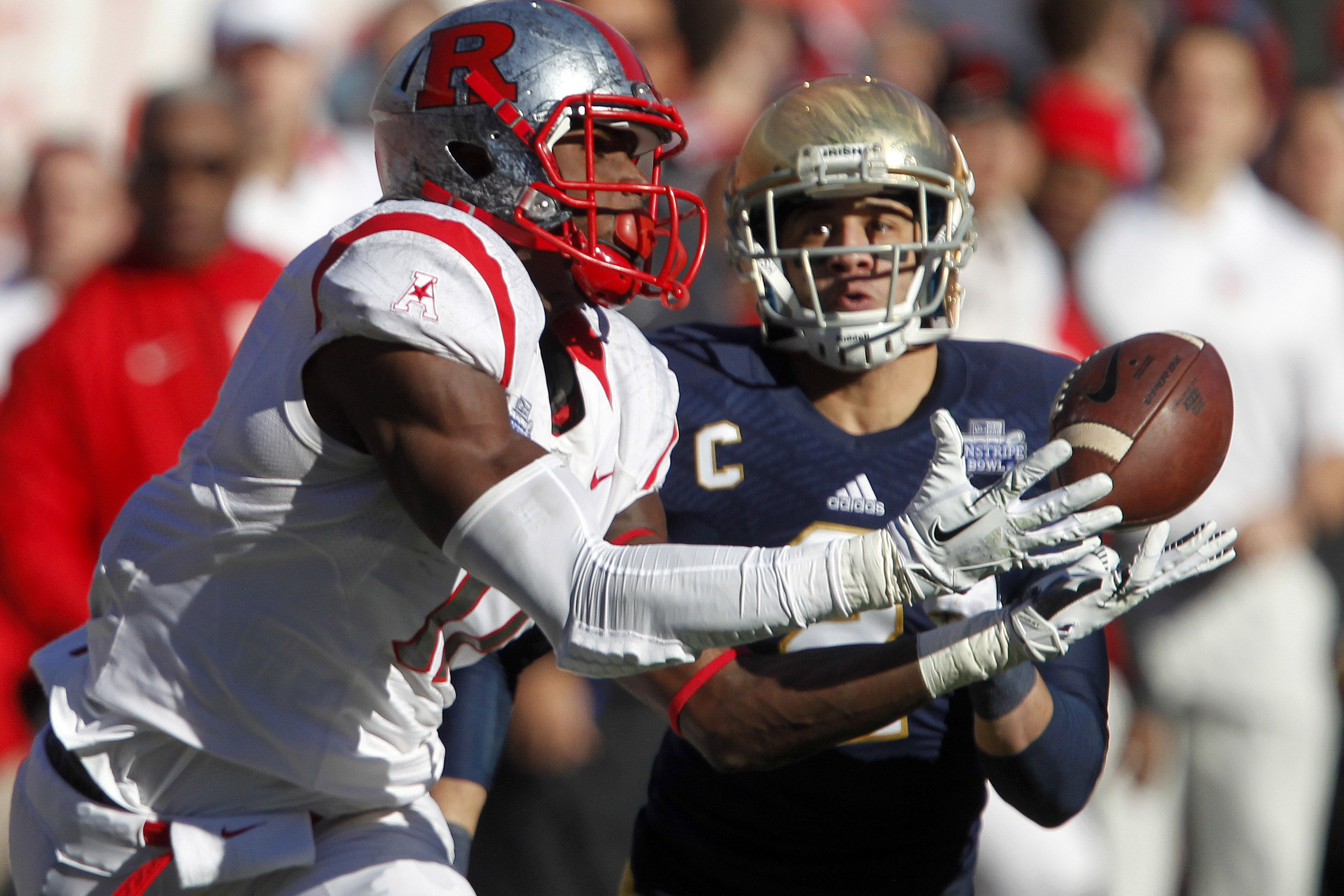 Dec 28, 2013; Bronx, NY, USA; Rutgers receiver Brandon Coleman (17) catches a pass against the Notre Dame Fighting Irish during the game in the Pinstripe Bowl at Yankee Stadium. Mandatory Credit: Aristide Economopoulos/THE STAR-LEDGER via USA TODAY Sports