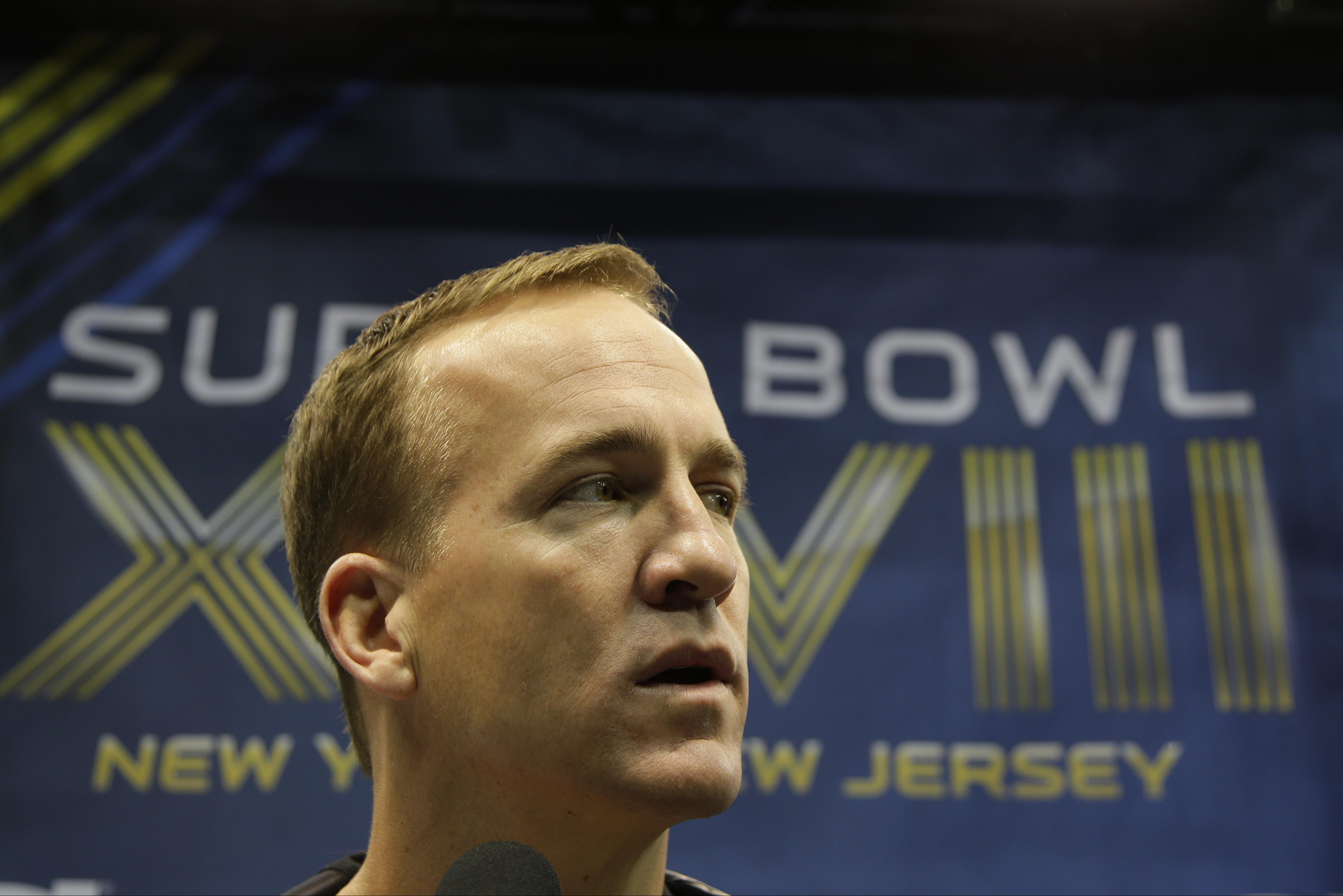 Denver Broncos' Peyton Manning answers questions during media day for the NFL Super Bowl XLVIII football game Tuesday, Jan. 28, 2014, in Newark, N.J. (AP Photo/Matt Slocum)