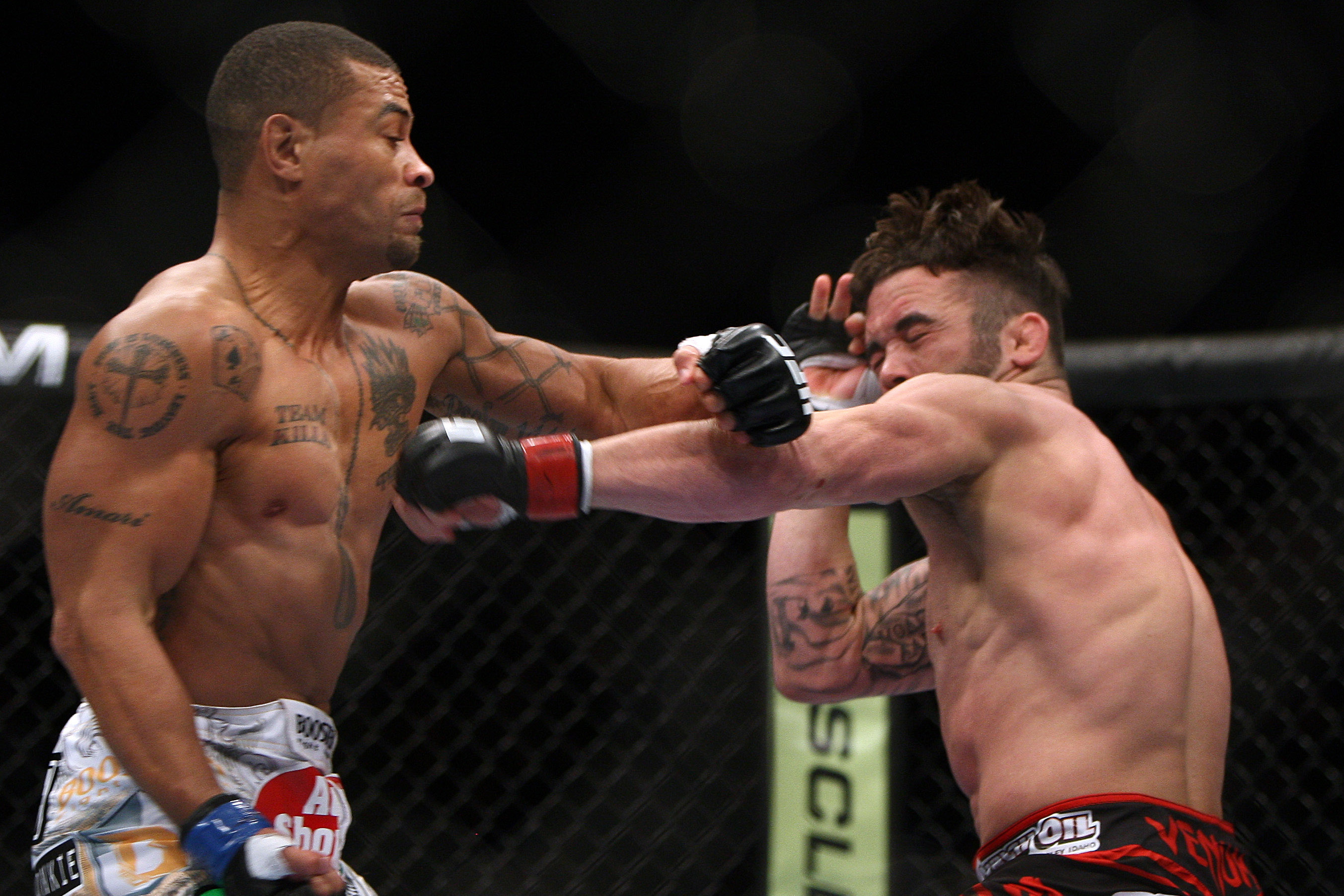 Jamie Varner, right, and Abel Trujillo fight during the first round of a UFC 169 lightweight mixed martial arts bout in Newark, N.J., Saturday, Feb. 1, 2014. Trujillo won by knockout in the second round. (AP Photo/Tim Larsen)