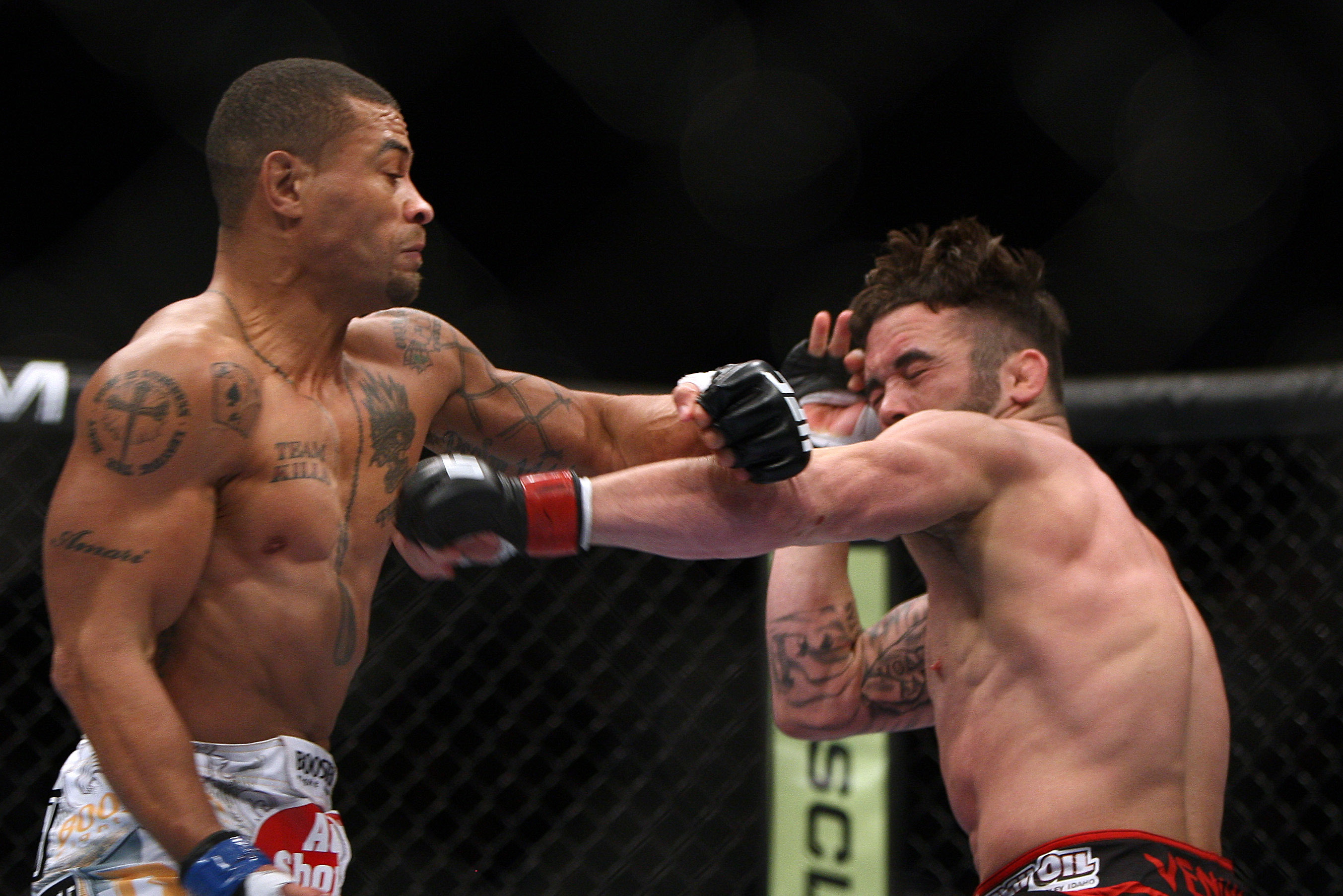 Jamie Varner, right, and Abel Trujillo fight during the first round of a UFC 169 lightweight mixed martial arts bout in Newark, N.J., Saturday, Feb. 1, 2014. Trujillo won by knockout in the second round. (AP Photo/Tim Larsen)