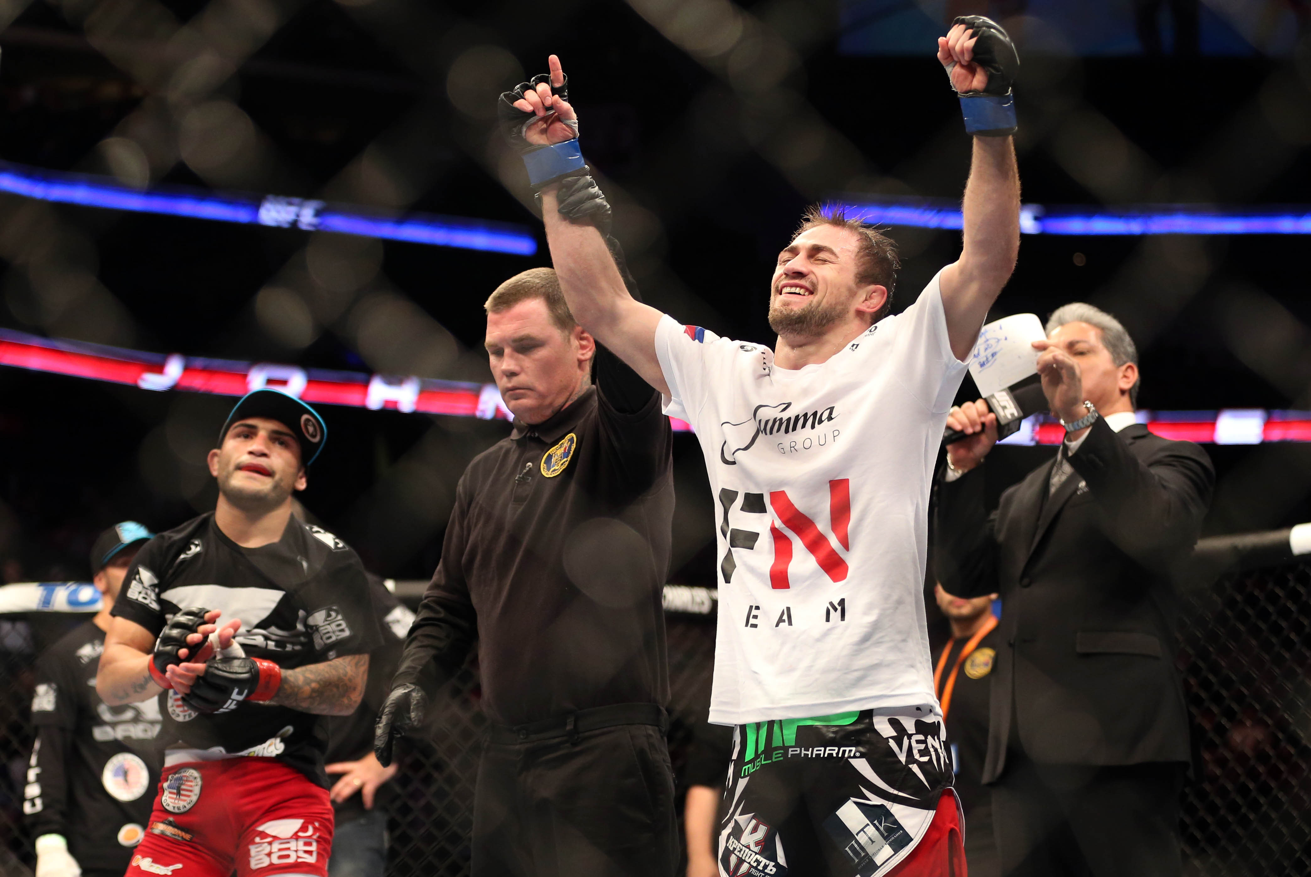 Feb 1, 2014; Newark, NJ, USA; Ali Bagautinov (blue gloves) celebrates beating John Lineker (red gloves) during UFC169 at Prudential Center. Mandatory Credit: Joe Camporeale-USA TODAY Sports
