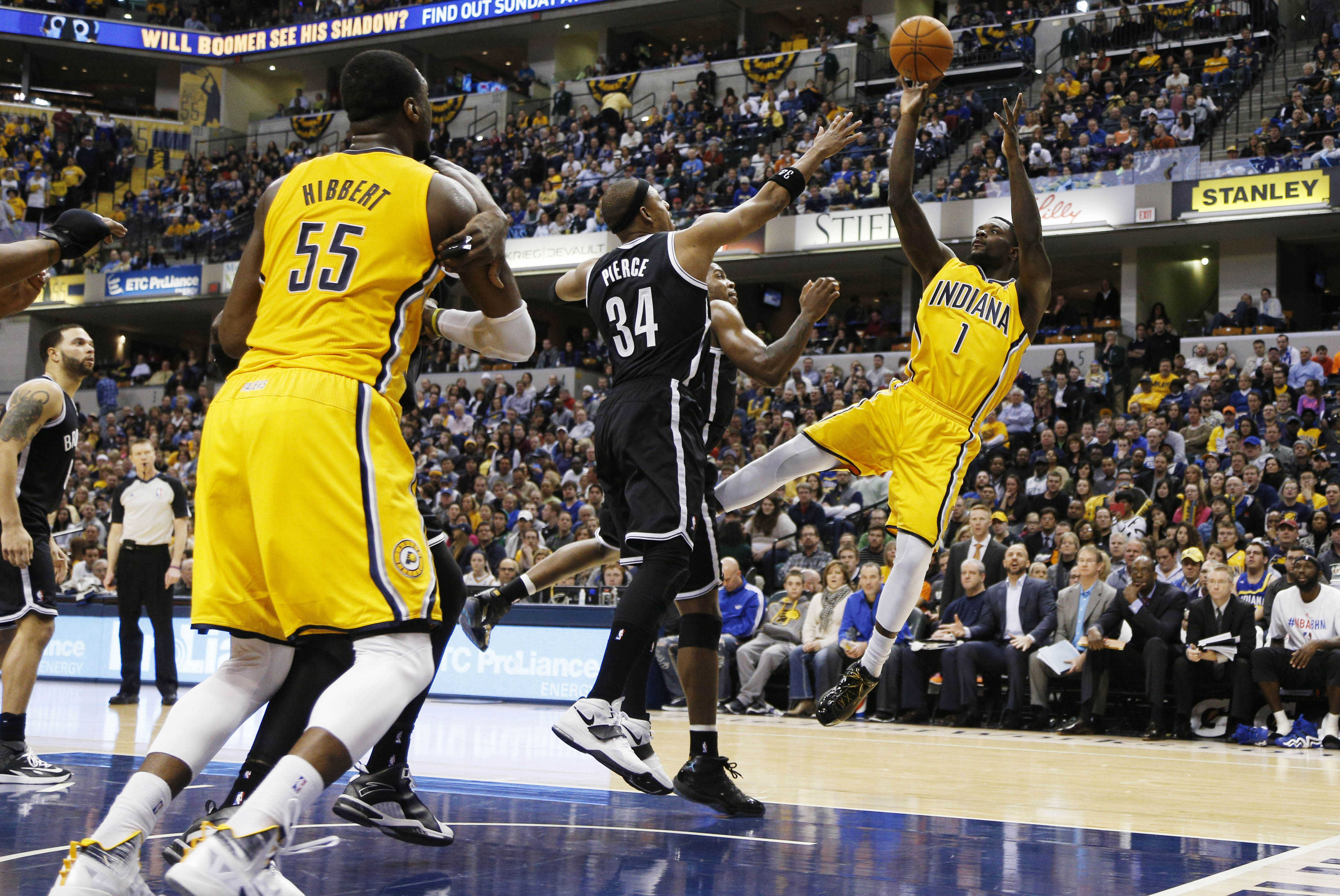 Feb 1, 2014; Indianapolis, IN, USA; Indiana Pacers guard Lance Stephenson (1) drives to the basket against Brooklyn Nets guard Joe Johnson (7) and forward Paul Pierce (24) at Bankers Life Fieldhouse. Indiana defeats Brooklyn 97-96. Mandatory Credit: Brian Spurlock-USA TODAY Sports