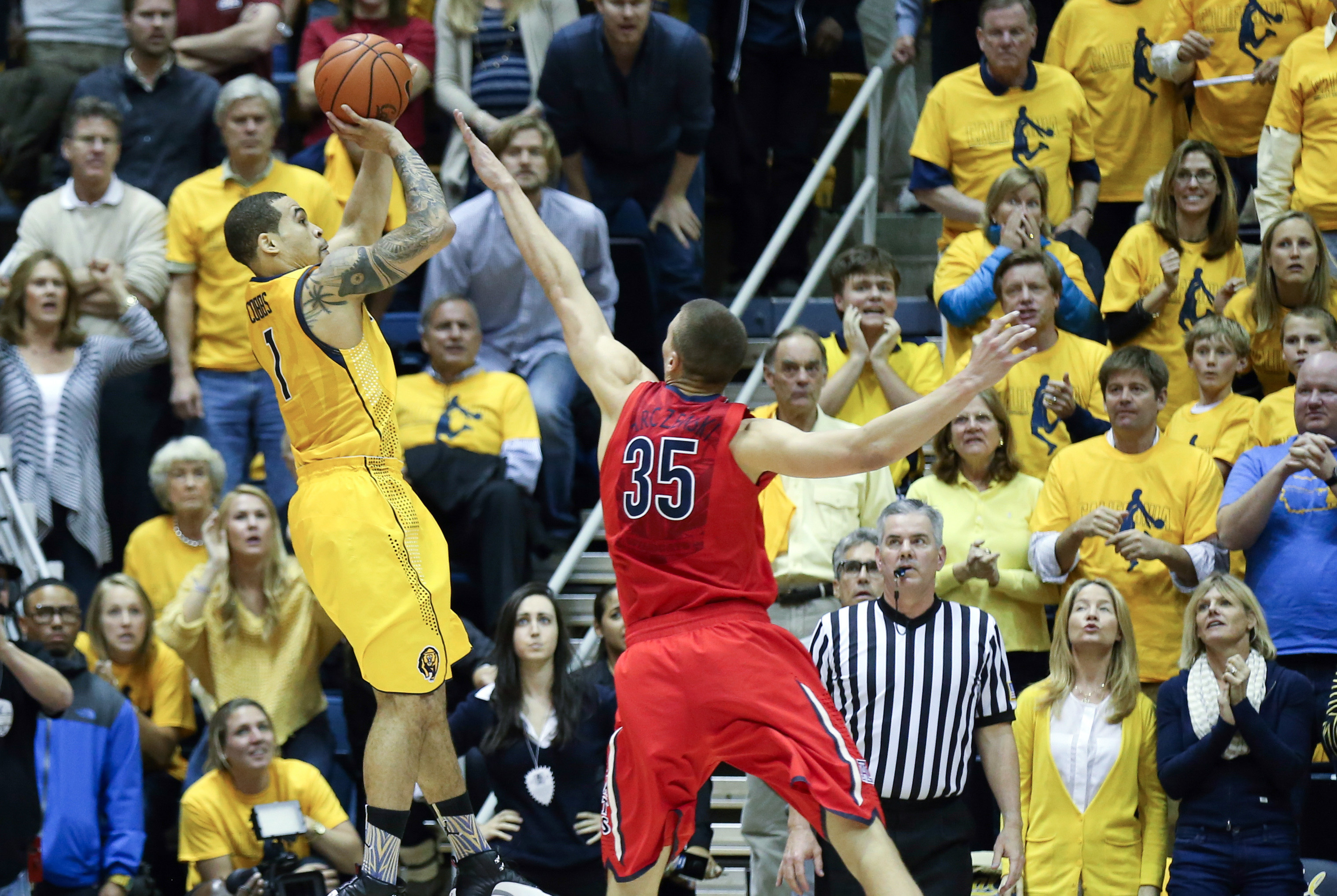 Feb 1, 2014; Berkeley, CA, USA; California Golden Bears guard Justin Cobbs (1) shoots the game winning shot against Arizona Wildcats center Kaleb Tarczewski (35) during the second half at Haas Pavilion. The California Golden Bears defeated the Arizona Wildcats 60-58. Mandatory Credit: Kelley L Cox-USA TODAY Sports