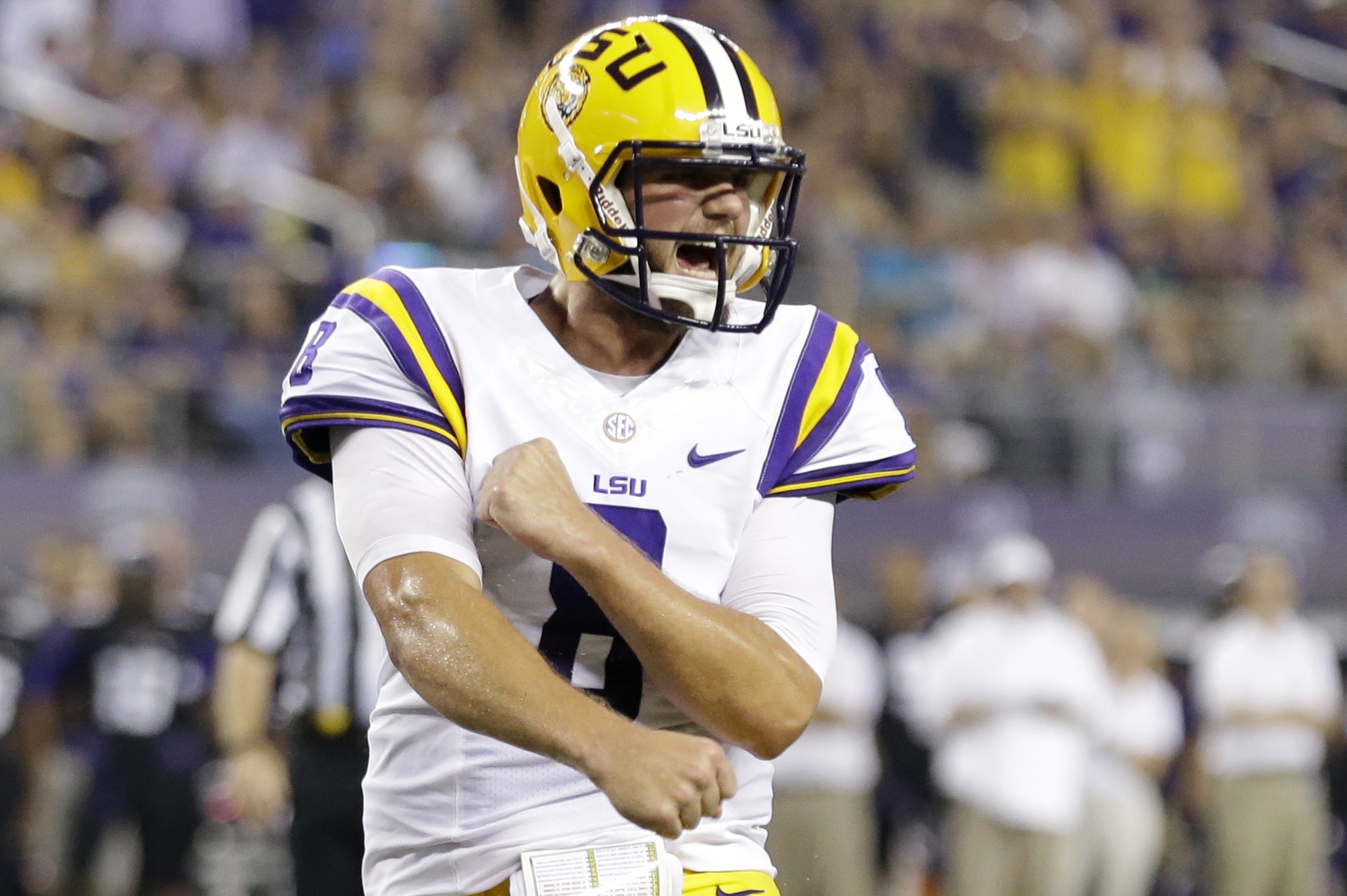LSU quarterback Zach Mettenberger (8)  celebrates a touchdown by teammate  J.C. Copeland during the first half of an NCAA college football game against TCU, Saturday, Aug. 31, 2013, in Arlington, Texas. (AP Photo/LM Otero)