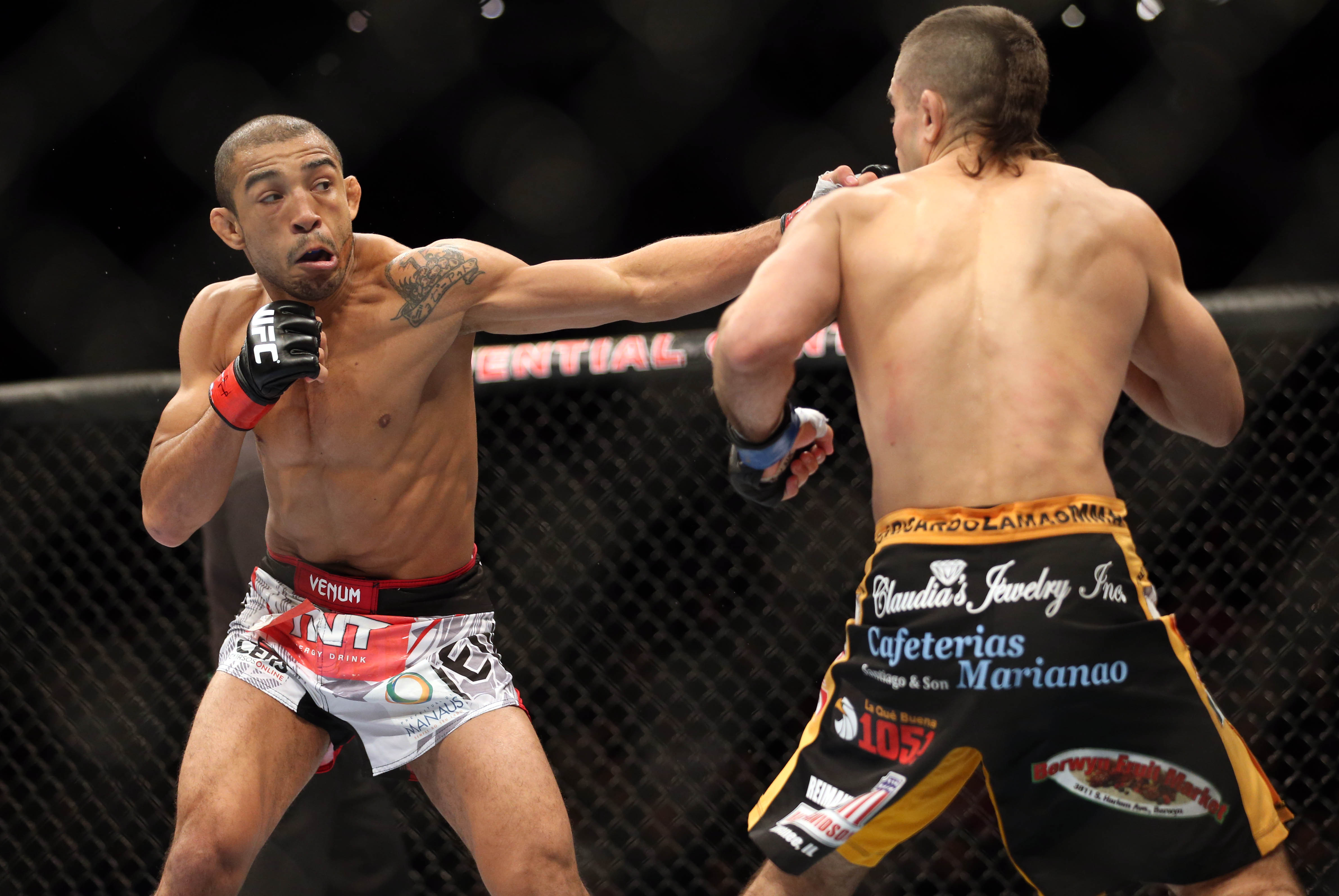Feb 1, 2014; Newark, NJ, USA; Jose Aldo (red gloves) fights Ricardo Lamas (blue gloves) during UFC 169 at Prudential Center. Mandatory Credit: Joe Camporeale-USA TODAY Sports