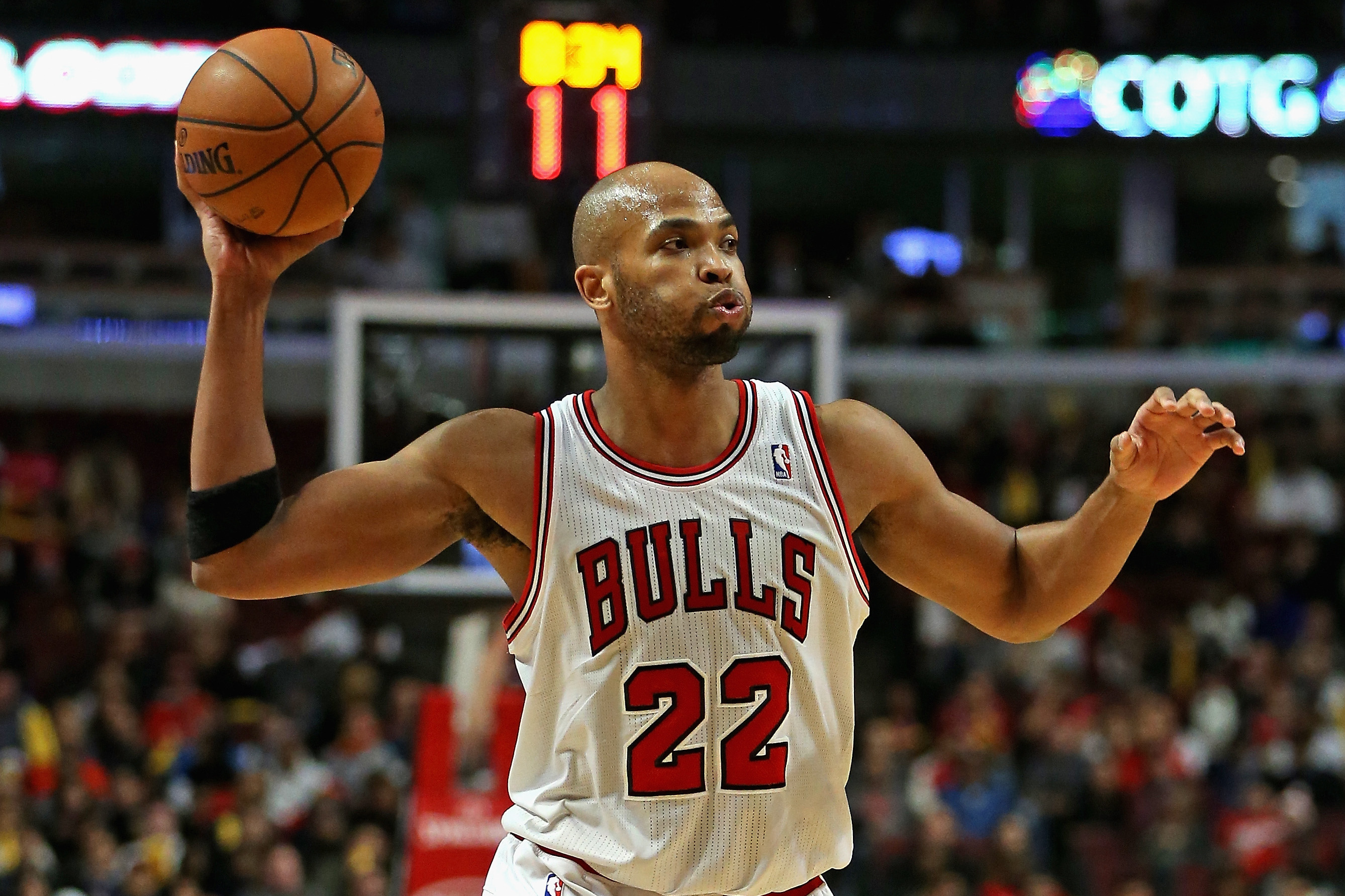 CHICAGO, IL - NOVEMBER 18:  Taj Gibson #22 of the Chicago Bulls looks to pass against the Charlotte Bobcats on November 18, 2013 in Chicago, Illinois. The Bulls defeated the Bobcats 86-81. NOTE TO USER: User expressly acknowledges and agrees that, by downloading and or using this photograph, User is consenting to the terms and conditions of the Getty Images License Agreement.  (Photo by Jonathan Daniel/Getty Images)