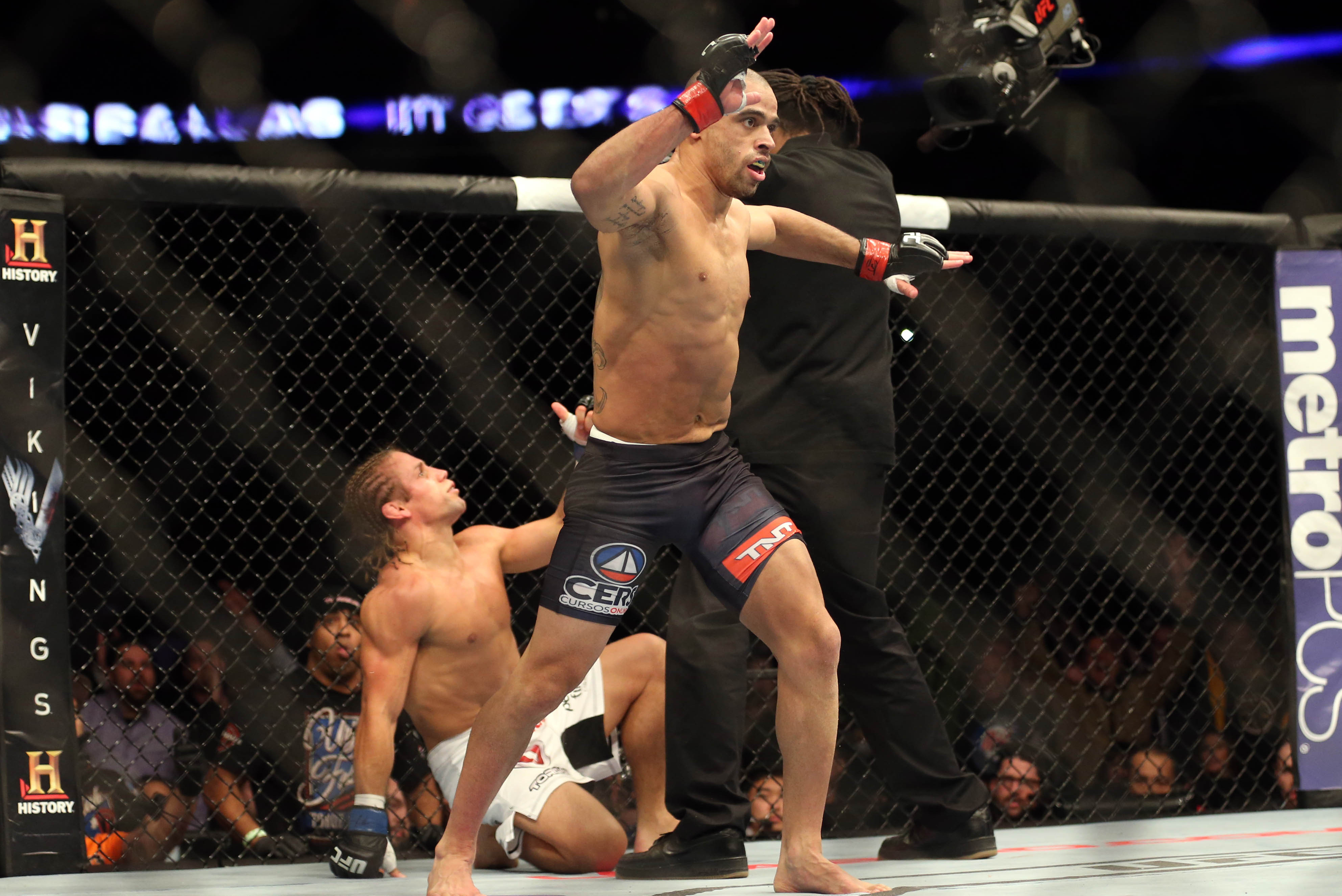 Feb 1, 2014; Newark, NJ, USA; Renan Barao (red gloves) fights Urijah Faber (blue gloves) during UFC 169 at Prudential Center. Mandatory Credit: Joe Camporeale-USA TODAY Sports