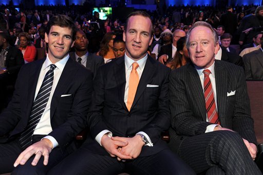 Eli Manning of the New York Giants, left, Peyton Manning of the Denver Broncos, center, and former NFL player Archie Manning at the 2nd Annual NFL Honors on Saturday, Feb. 2, 2013 in New Orleans. (Photo by Jordan Strauss/Invision/AP)