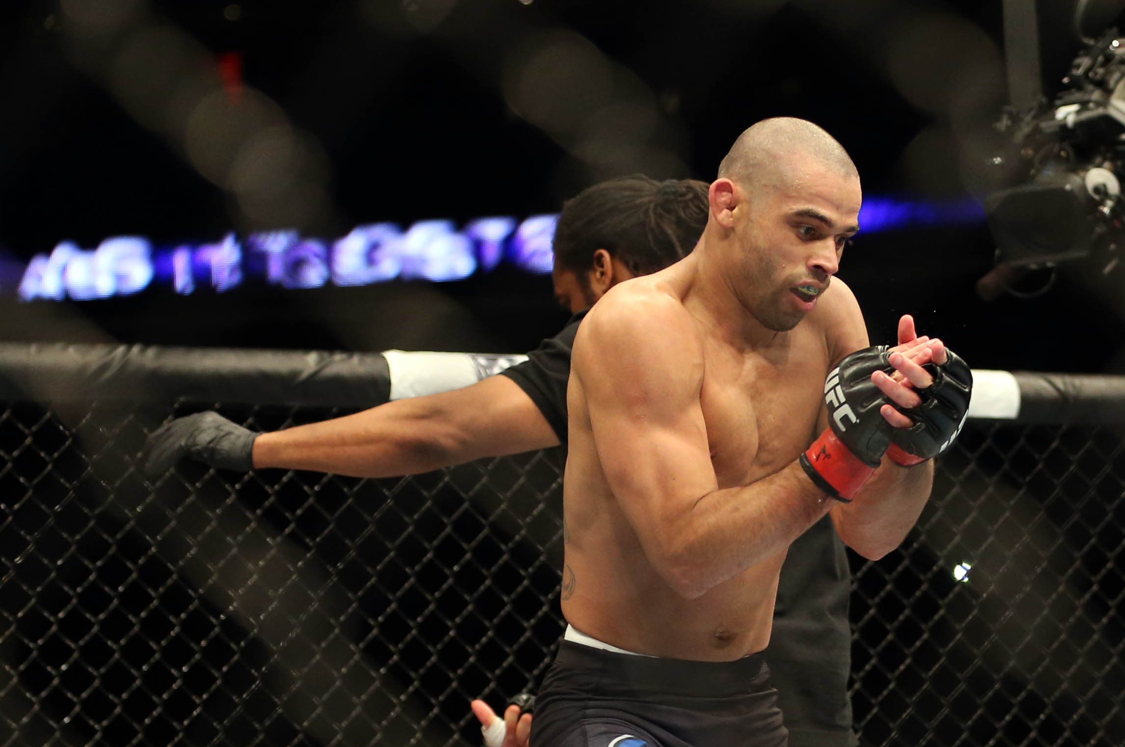 Feb 1, 2014; Newark, NJ, USA; Renan Barao (red gloves) celebrates beating Urijah Faber (blue gloves) during UFC 169 at Prudential Center. Mandatory Credit: Joe Camporeale-USA TODAY Sports