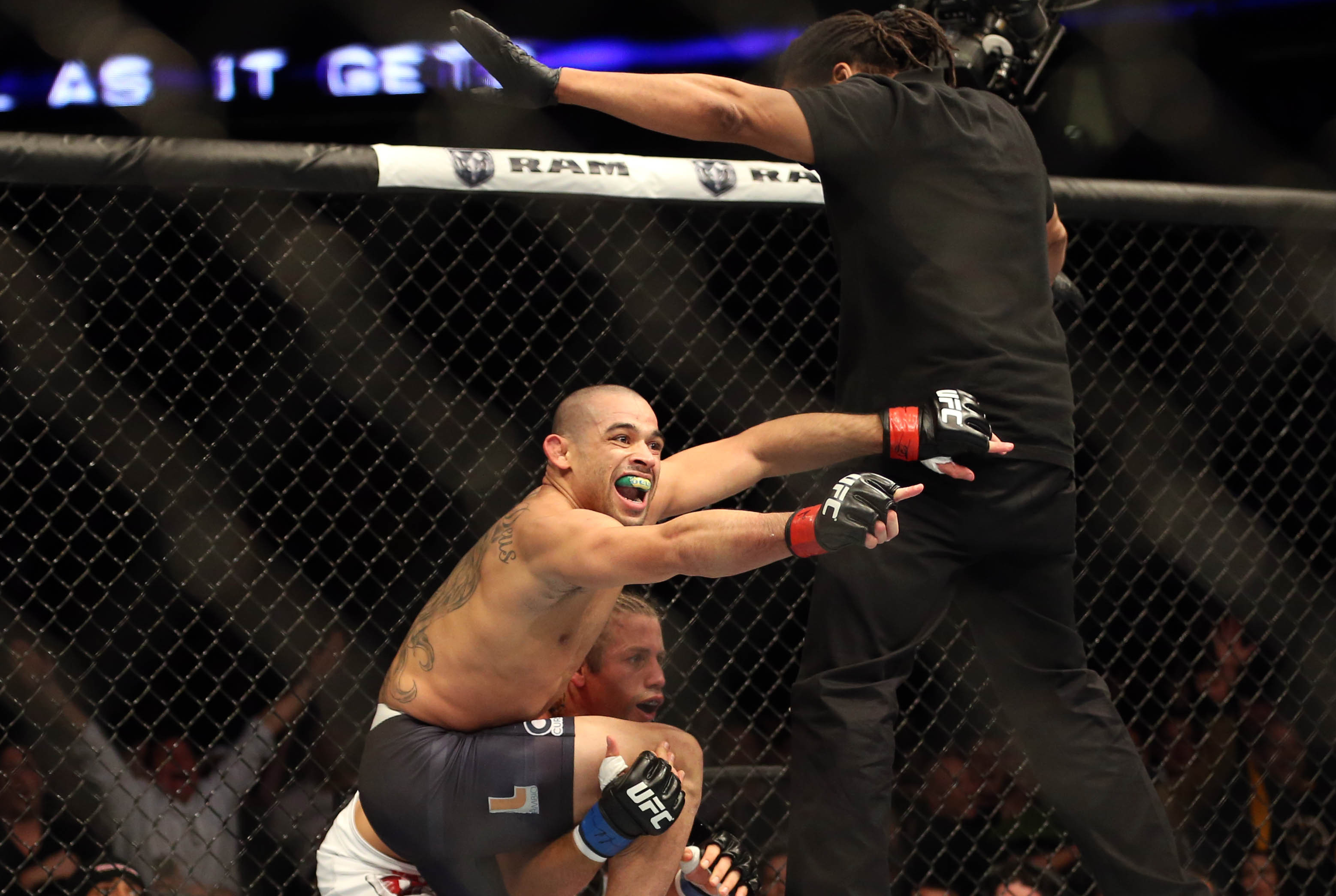 Feb 1, 2014; Newark, NJ, USA; Renan Barao (red gloves) celebrates beating Urijah Faber (blue gloves) during UFC 169 at Prudential Center. Mandatory Credit: Joe Camporeale-USA TODAY Sports